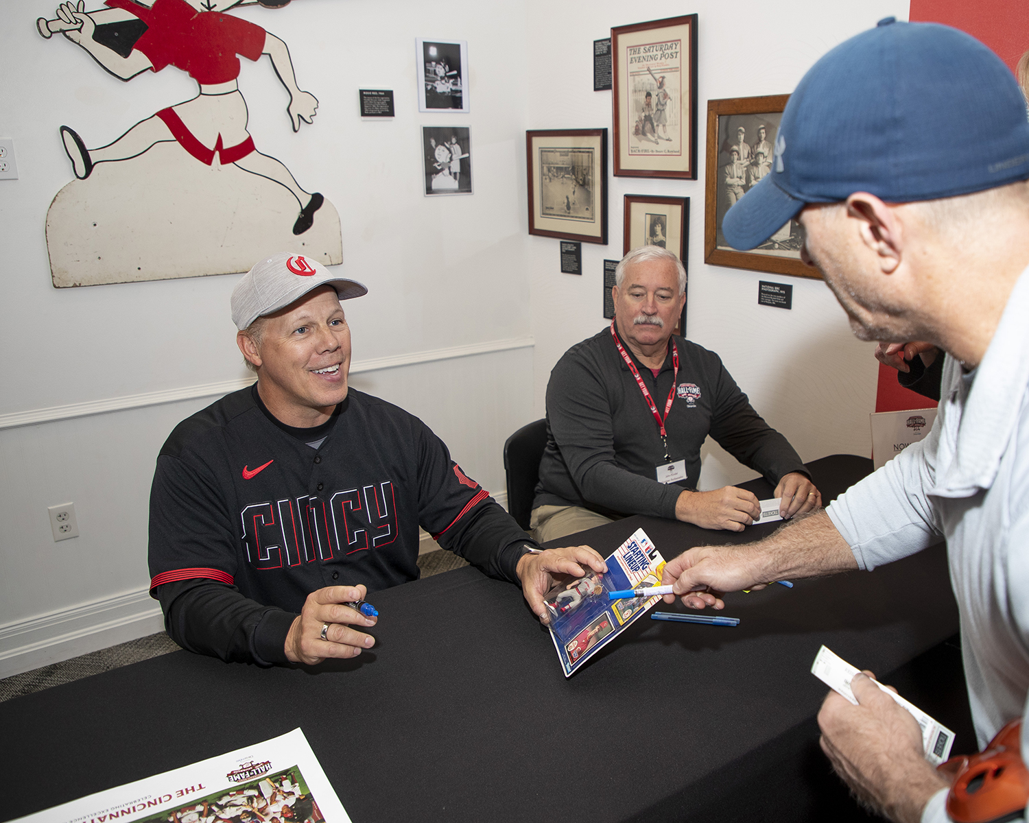 Todd Benzinger signing autographs (Photo courtesy of the Reds)