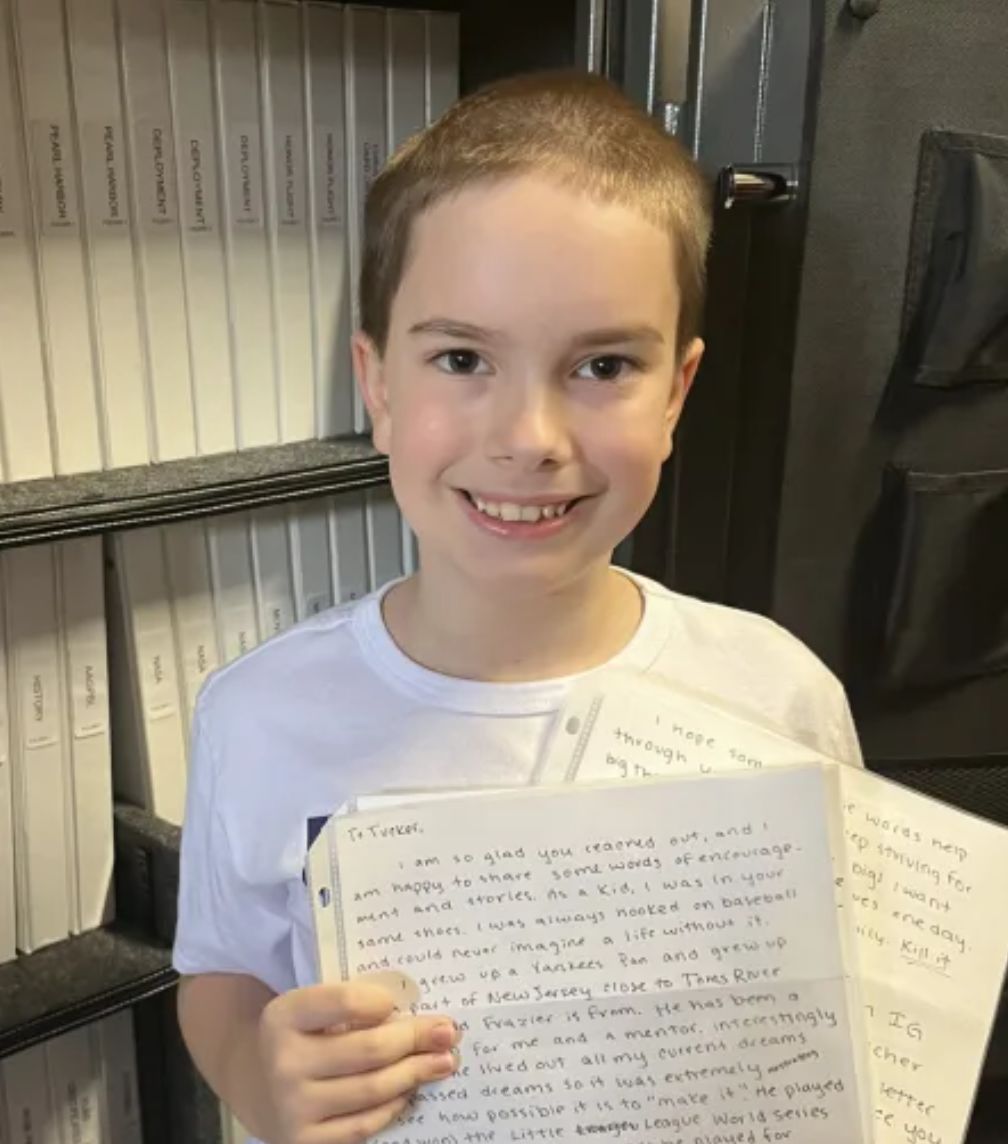 10-year-old Tucker Rose holds the letter he received from Andrew Fischer.