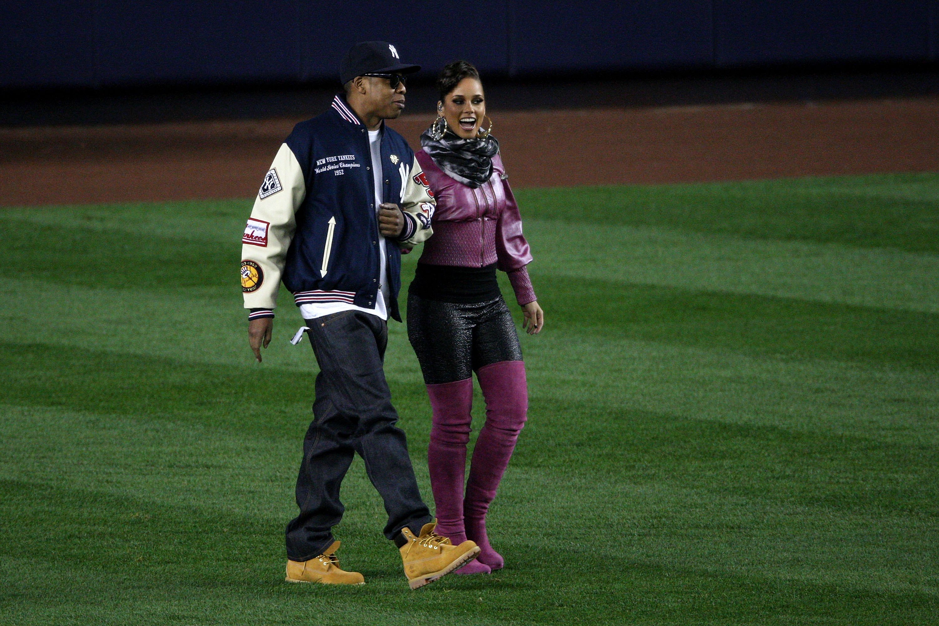 Jay-Z and Alicia Keys walk onto the field at Yankee Stadium before Game 2 of the 2009 World Series. (Getty Images)