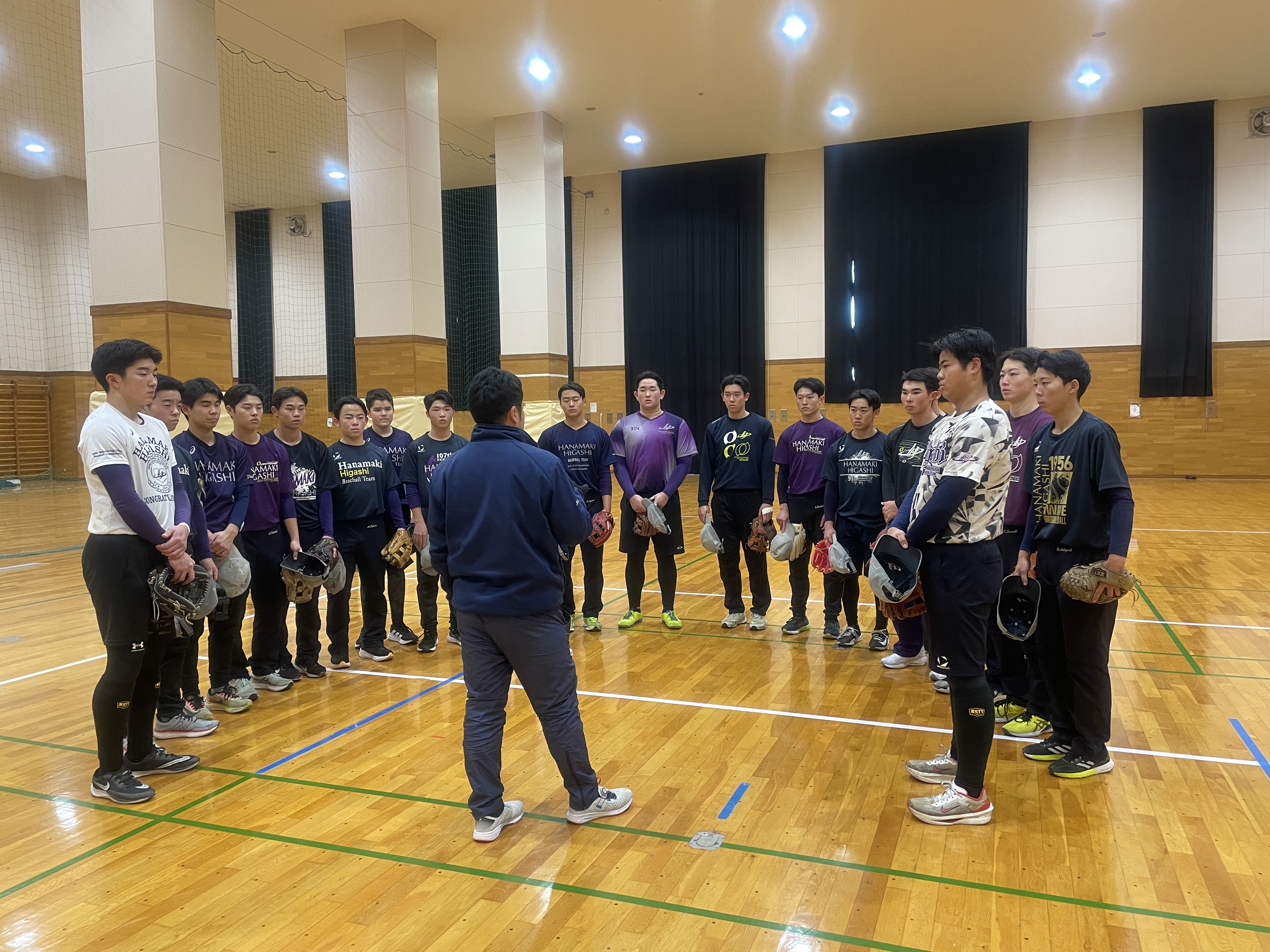 Players on the boys team get ready for an indoor practice.