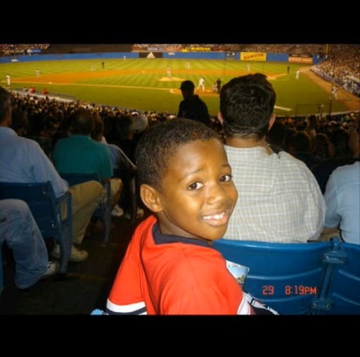 Little Ronald watching his older cousin, Kelvim, pitch at Yankee Stadium/Photo via Kelvim Escobar