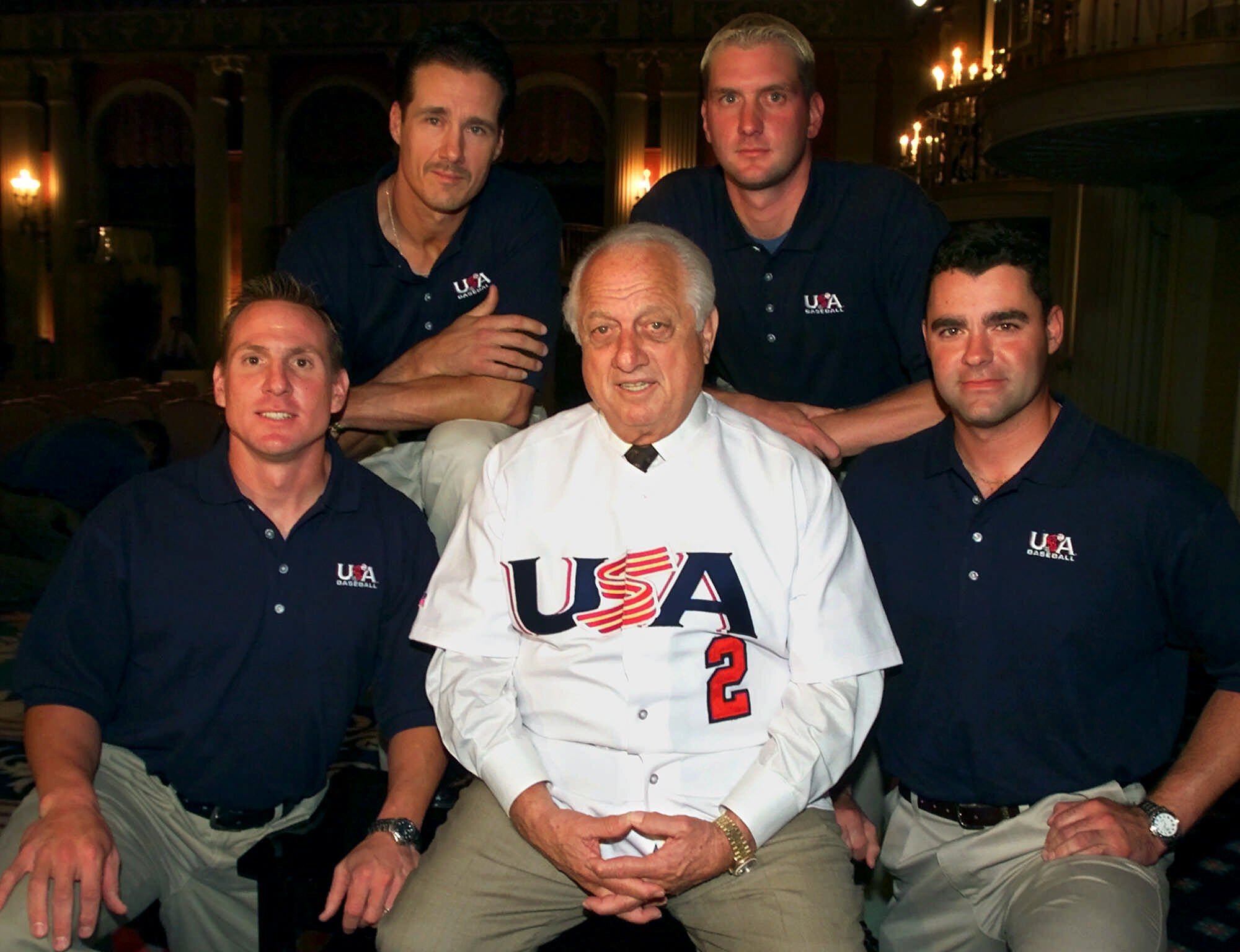 Pat Borders (top left) poses with Shawn Gilbert (bottom left), Todd Williams (top right), Mike Neill (bottom right), and Tommy Lasorda (center).