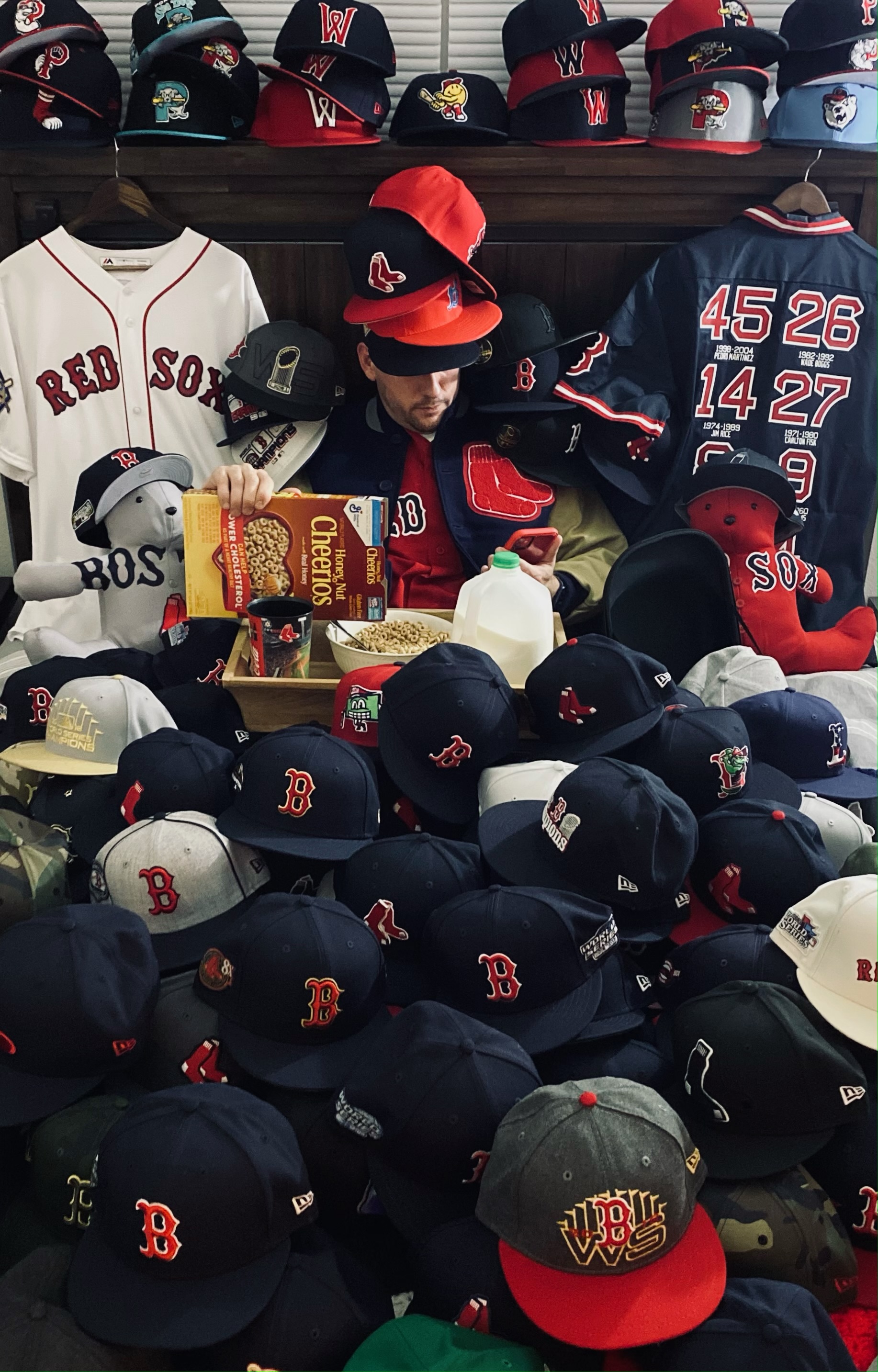 Pierre Morin, buried under an avalanche of Red Sox caps.