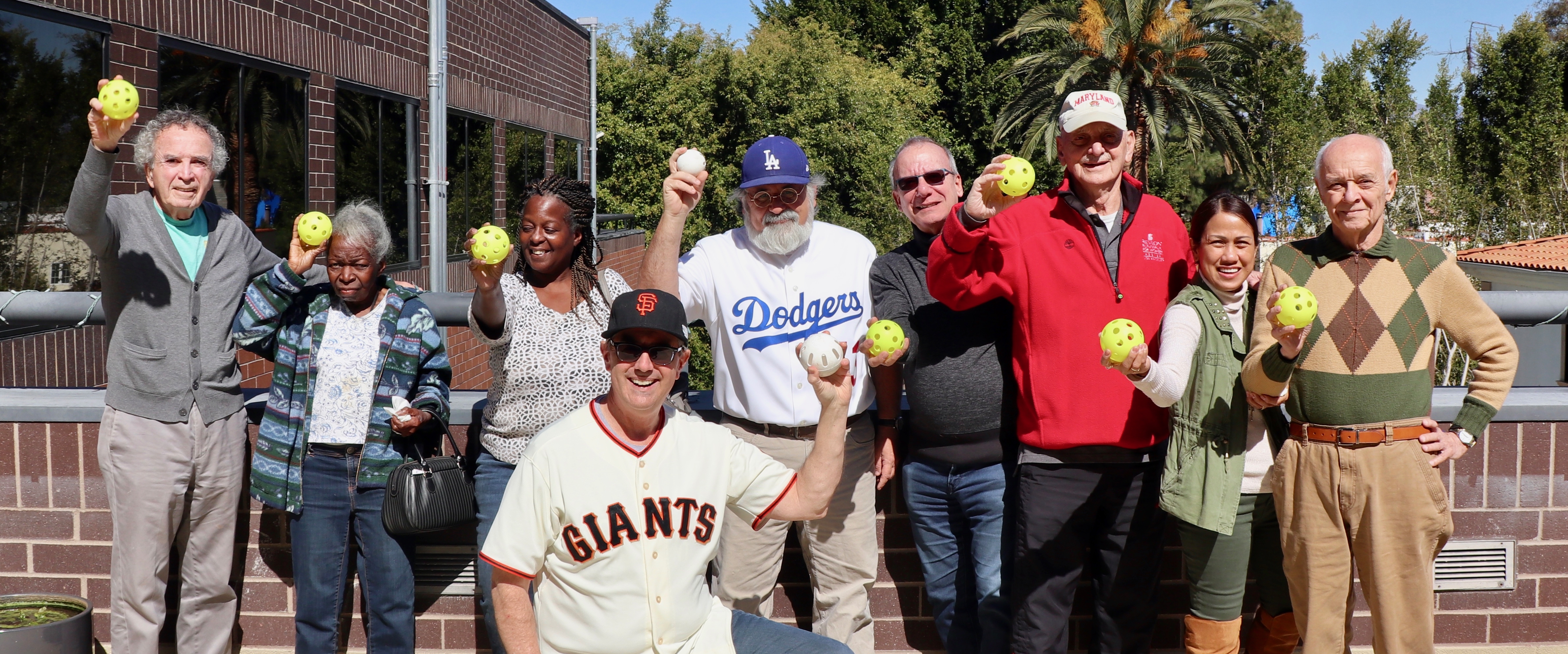 The Alzheimer’s Los Angeles gang, led by SABR members Dr. Jeff Hubbard (Dodgers jersey) and Jon Leonoudakis (Giants jersey).