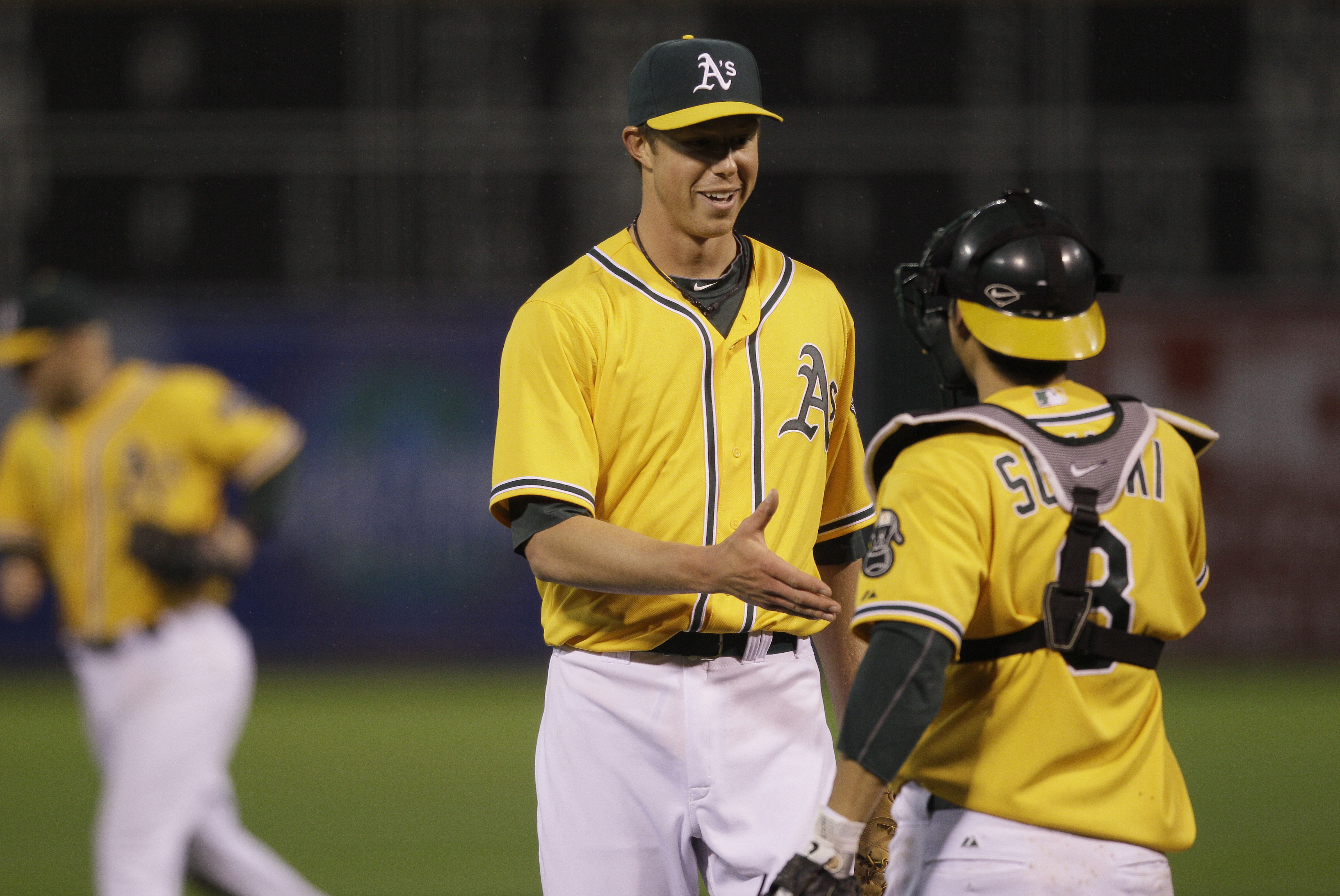 Magnuson shakes hands with now-Angels manager Kurt Suzuki after his MLB debut