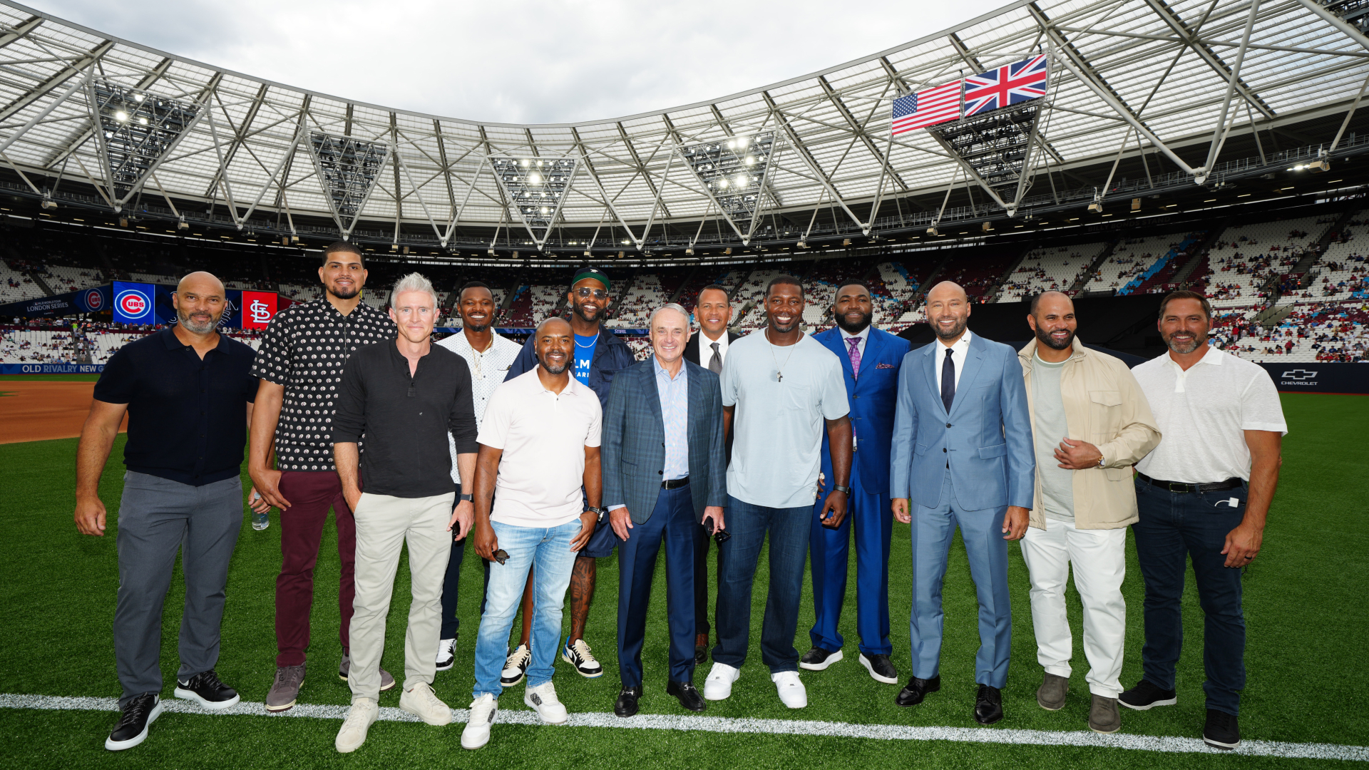 Commissioner Rob Manfred (center) and several former MLB stars pose for a photo at London Stadium