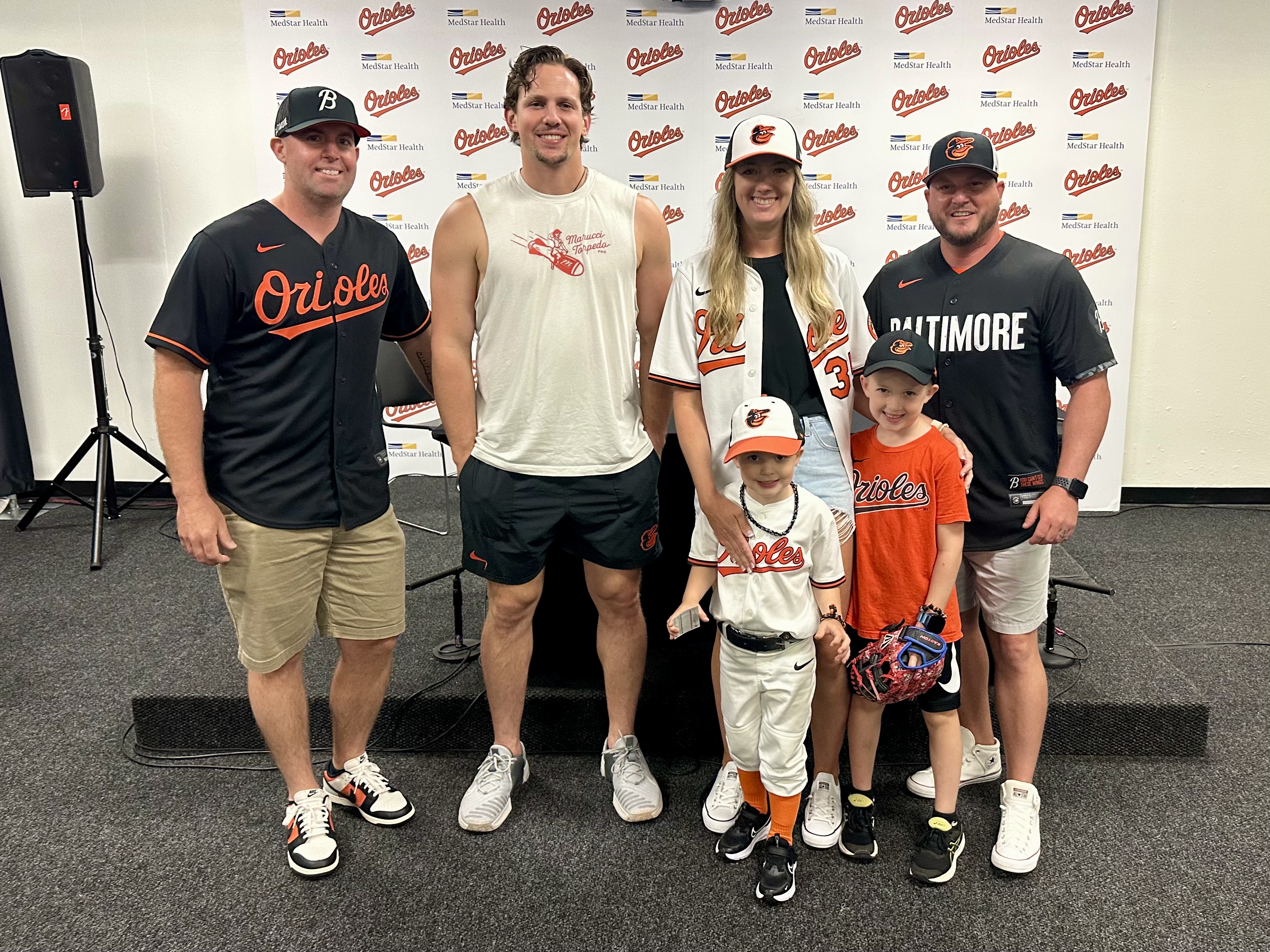 Adley Rutschman poses with the Henry family.