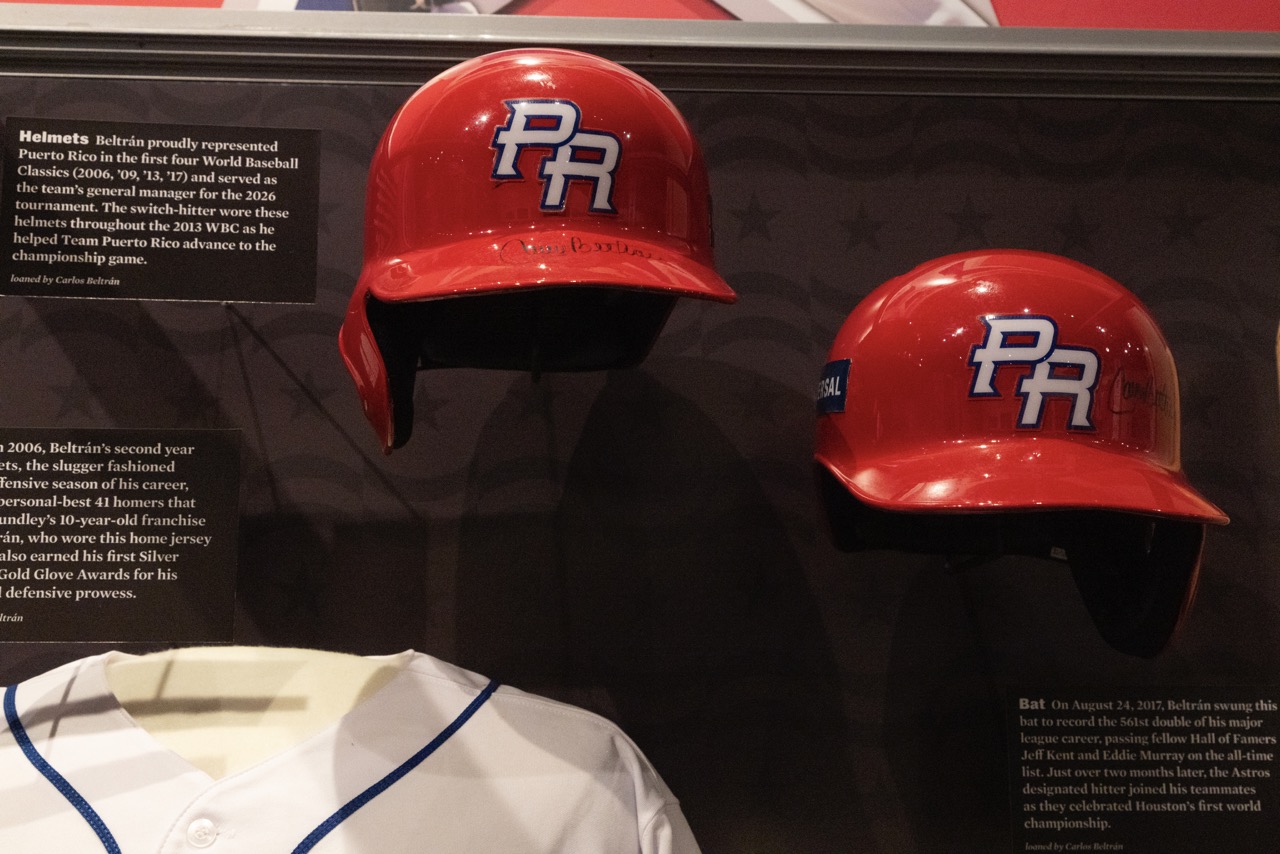 Carlos Beltrán's Puerto Rico batting helmets on display. Milo Stewart Jr./National Baseball Hall of Fame and Museum. On loan from Carlos Beltrán.