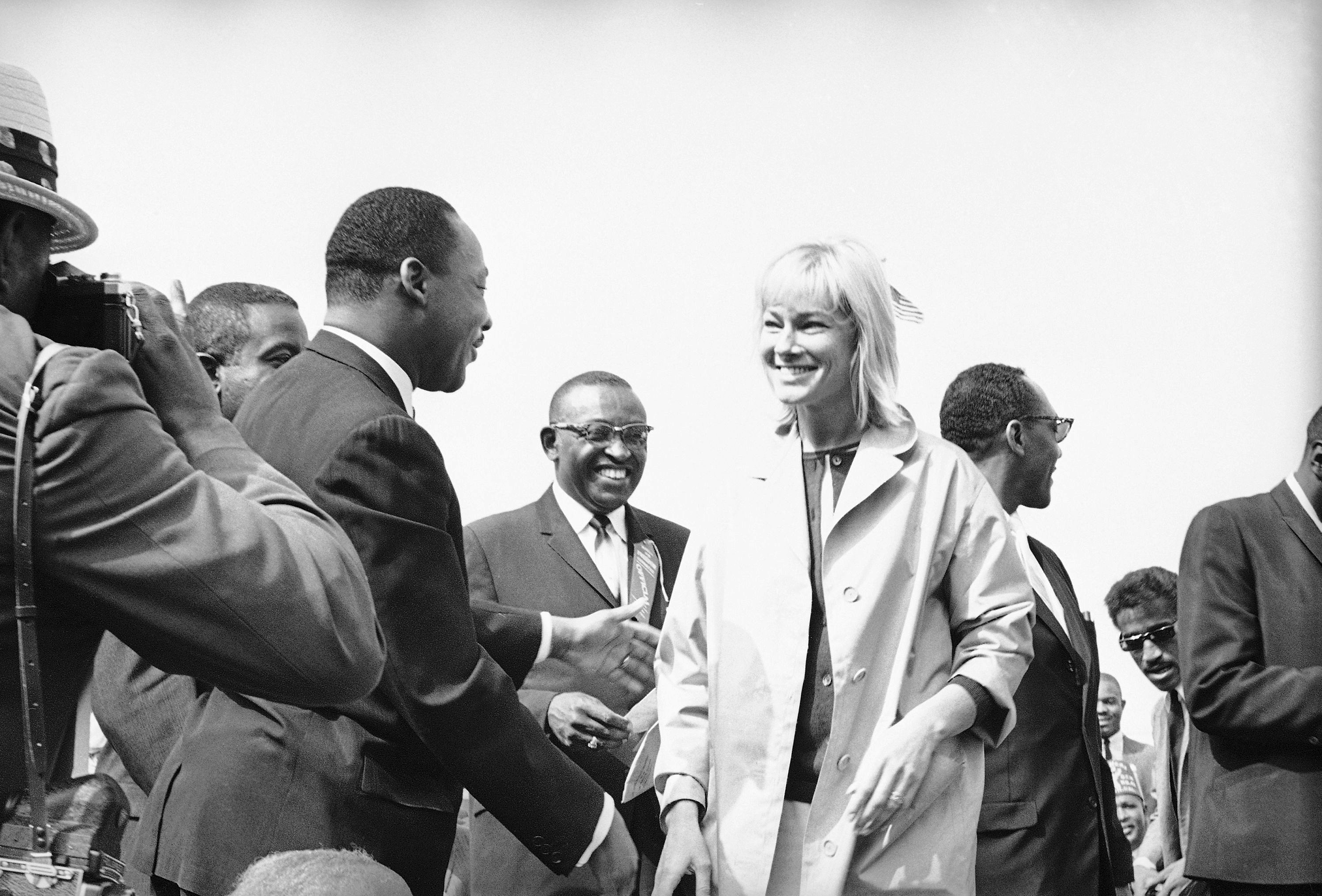 Martin Luther King Jr. greets actress May Britt at a civil rights rally at Wrigley Field in Los Angeles, May 26, 1963. (AP Photo/David Smith)