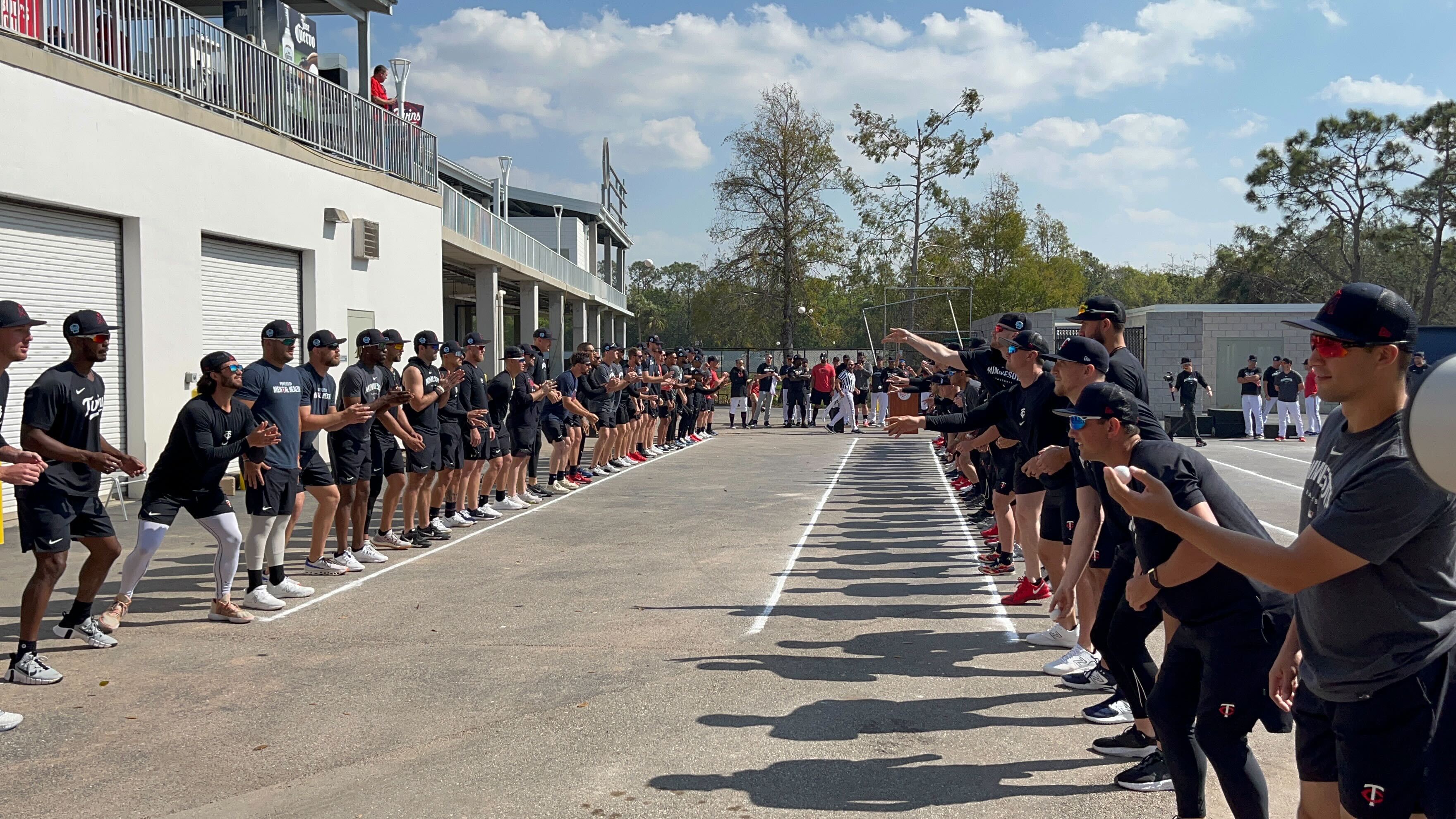 Twins players compete in an egg toss competition