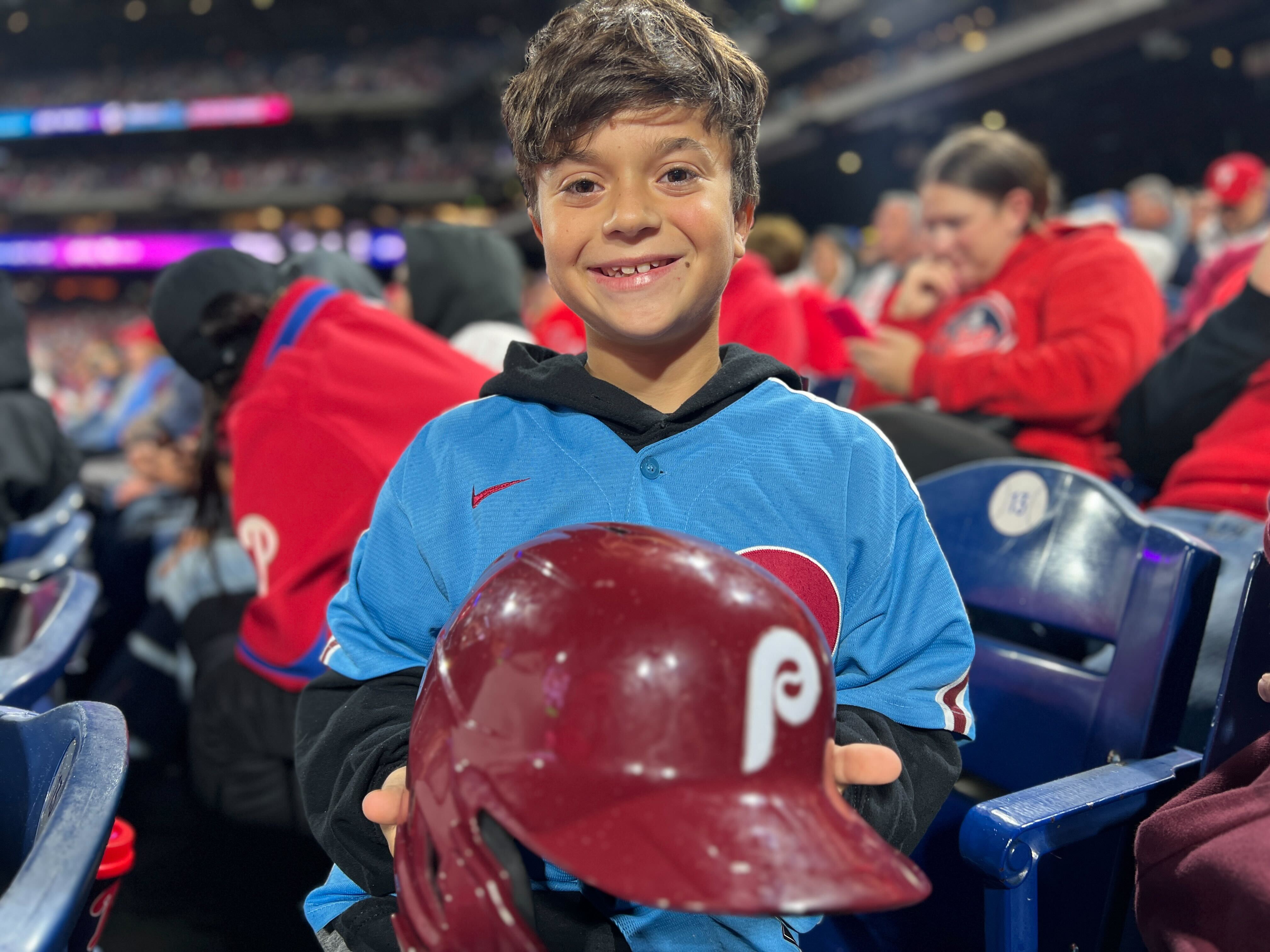 Young Phillies fan Hayden Dorfman proudly displays his one-of-a-kind souvenir.
