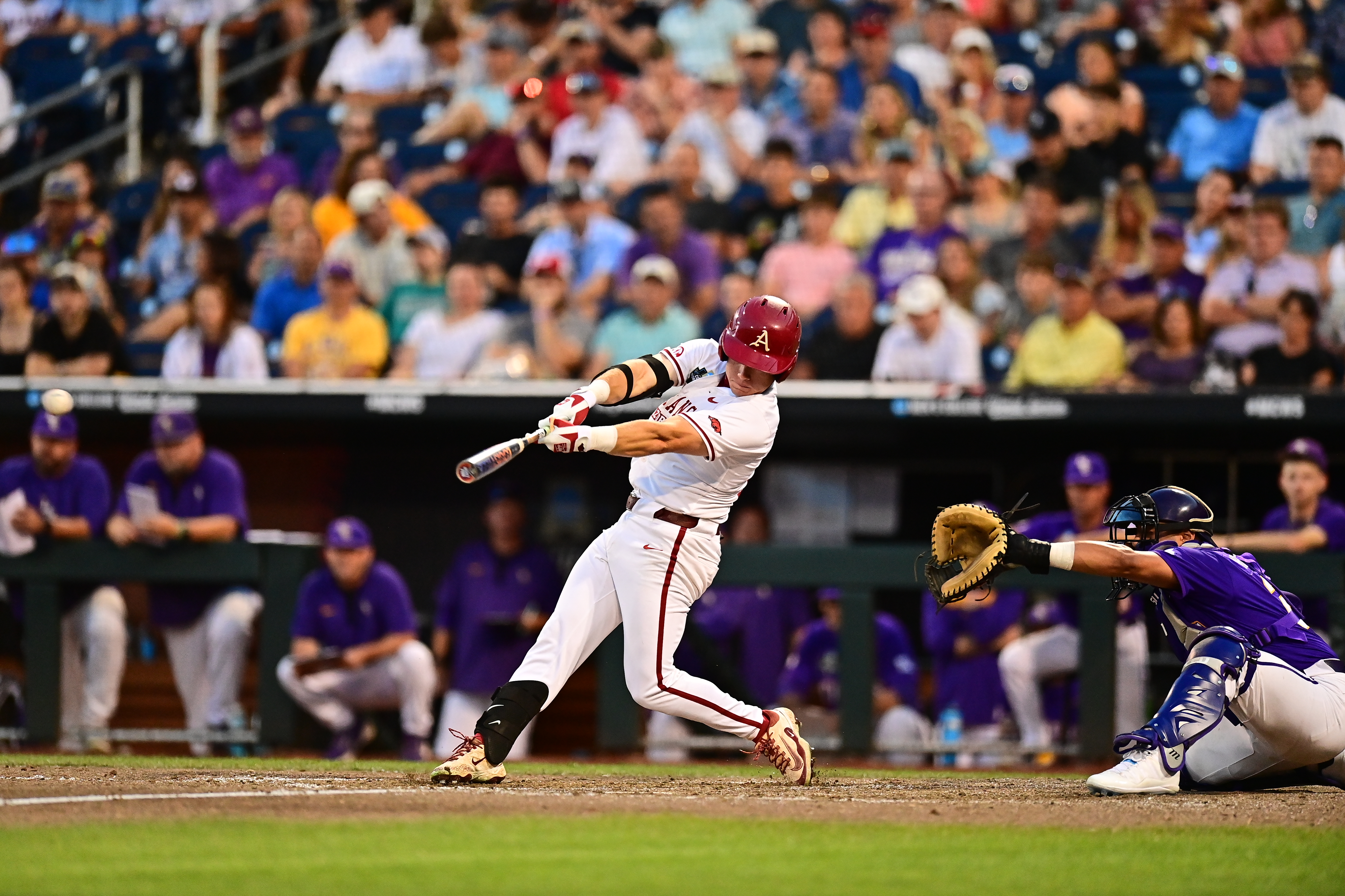 Charles Davalan connects. Photo courtesy Arkansas Athletics.