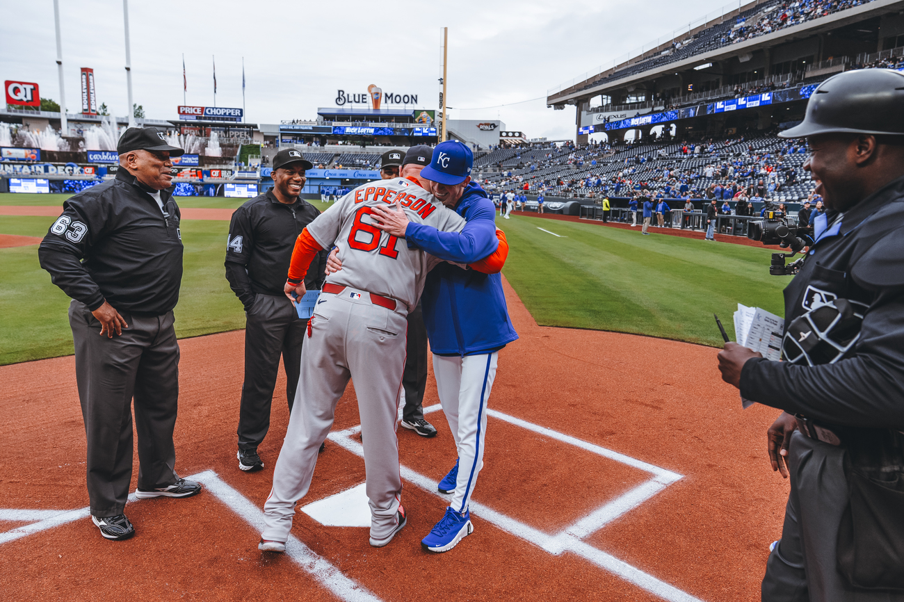 Chad and Drew Epperson hugging at home plate (Courtesy of Drew Epperson)