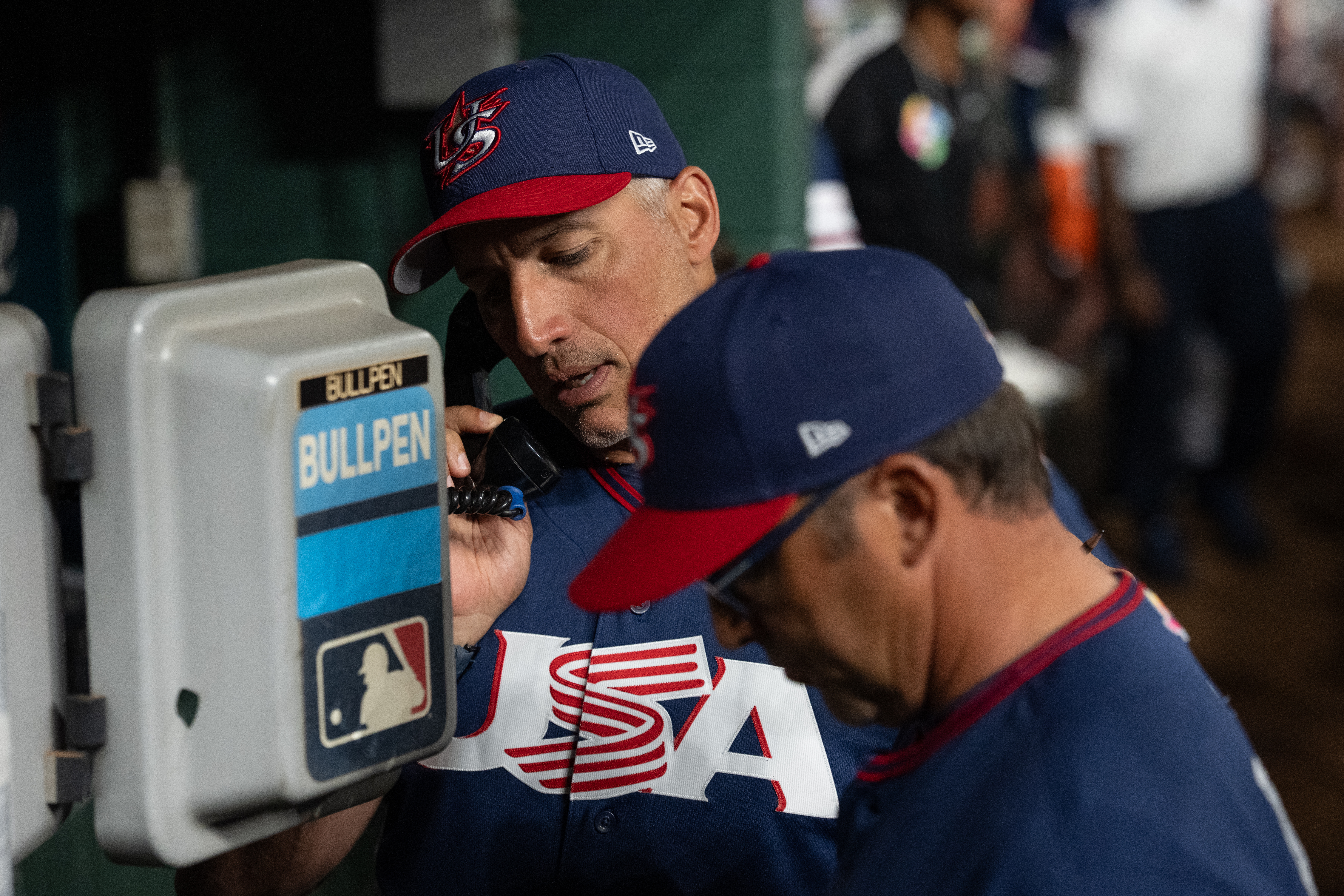 Photo of Team USA pitching coach Andy Pettitte and manager Mark DeRosa by Ken Griffey Jr.