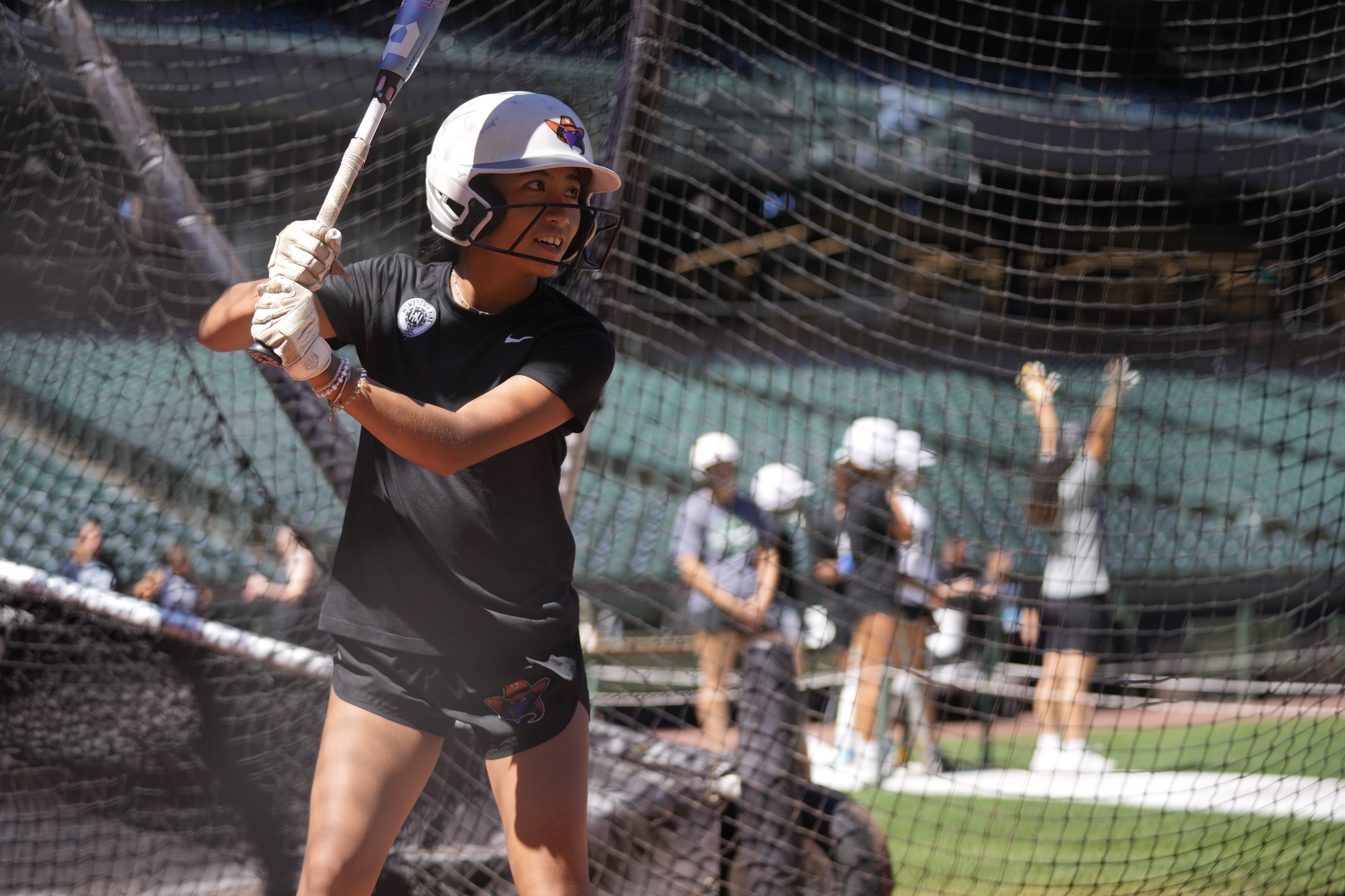 Hometown Nine member Kaila Ignacio taking batting practice at T-Mobile Park.