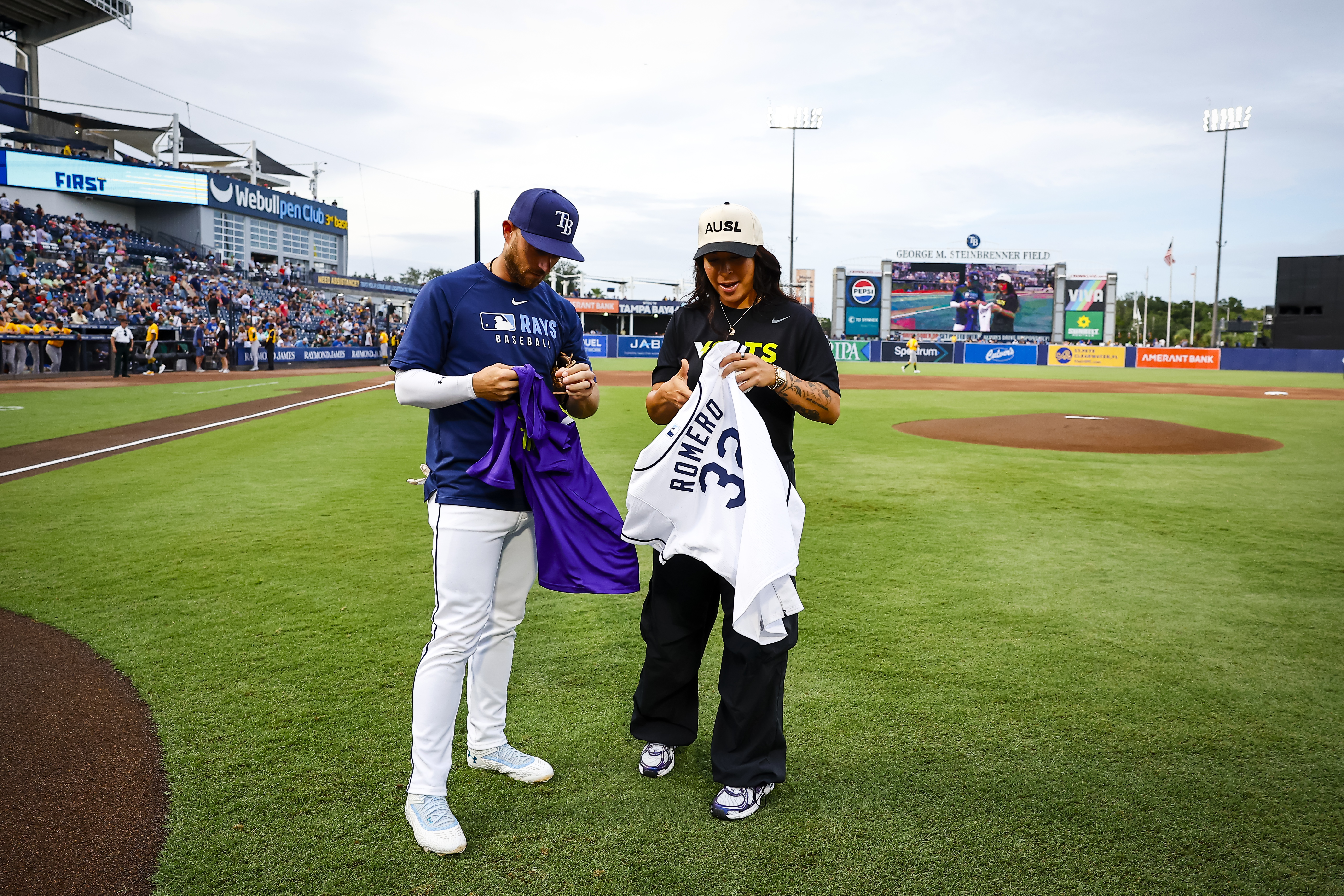 Brandon Lowe and Sierra Romero swapped a Rays and AUSL Volts jersey.