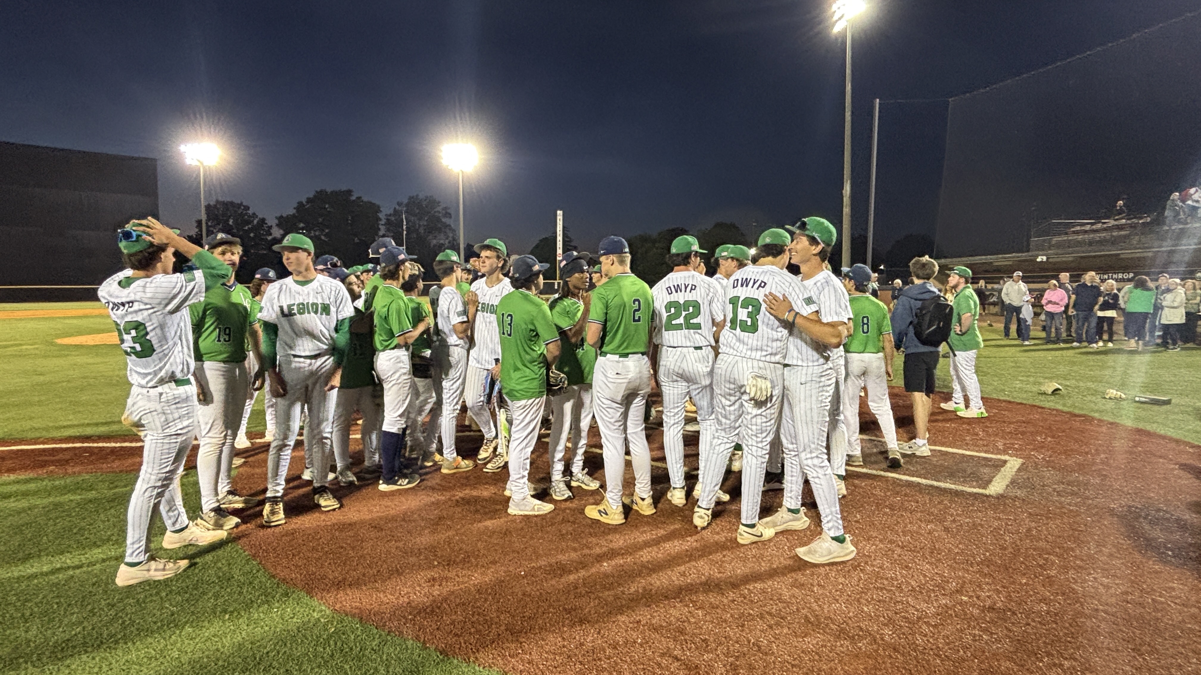 Lancers players gather at home plate on Senior Night (Photo by Anthony Castrovince)