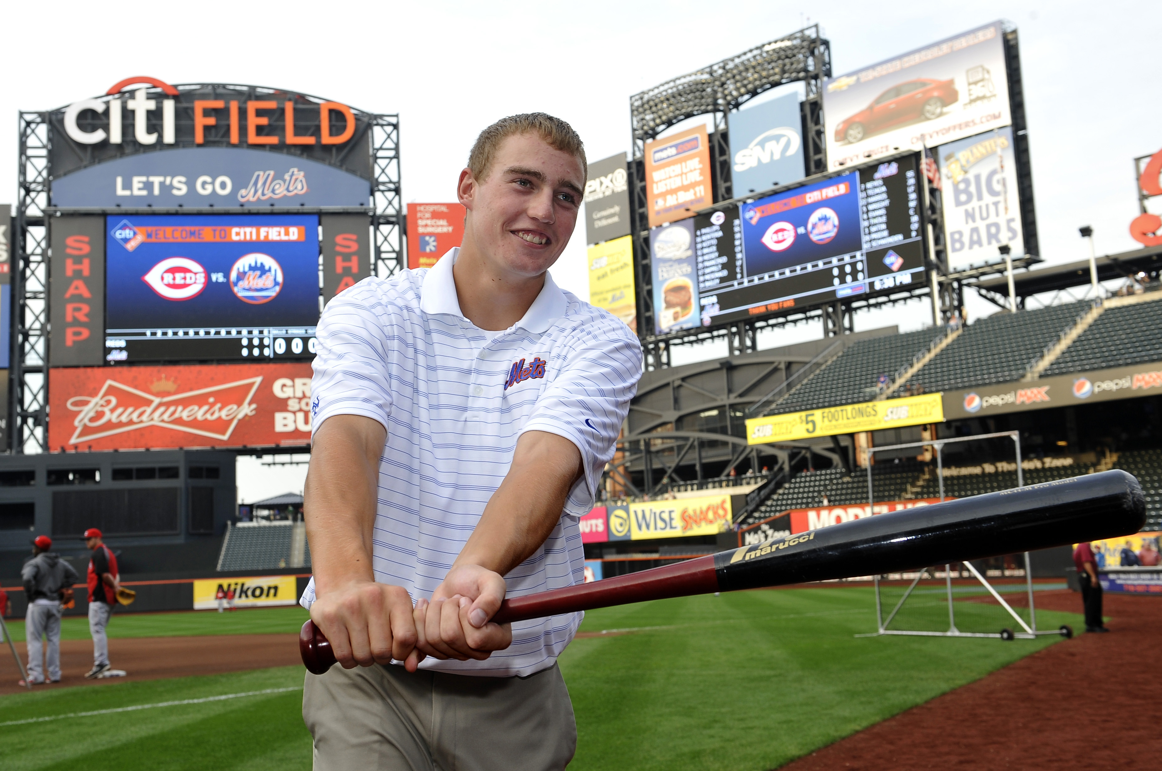 Brandon Nimmo after being drafted and signed by the Mets in 2011 (AP Images)