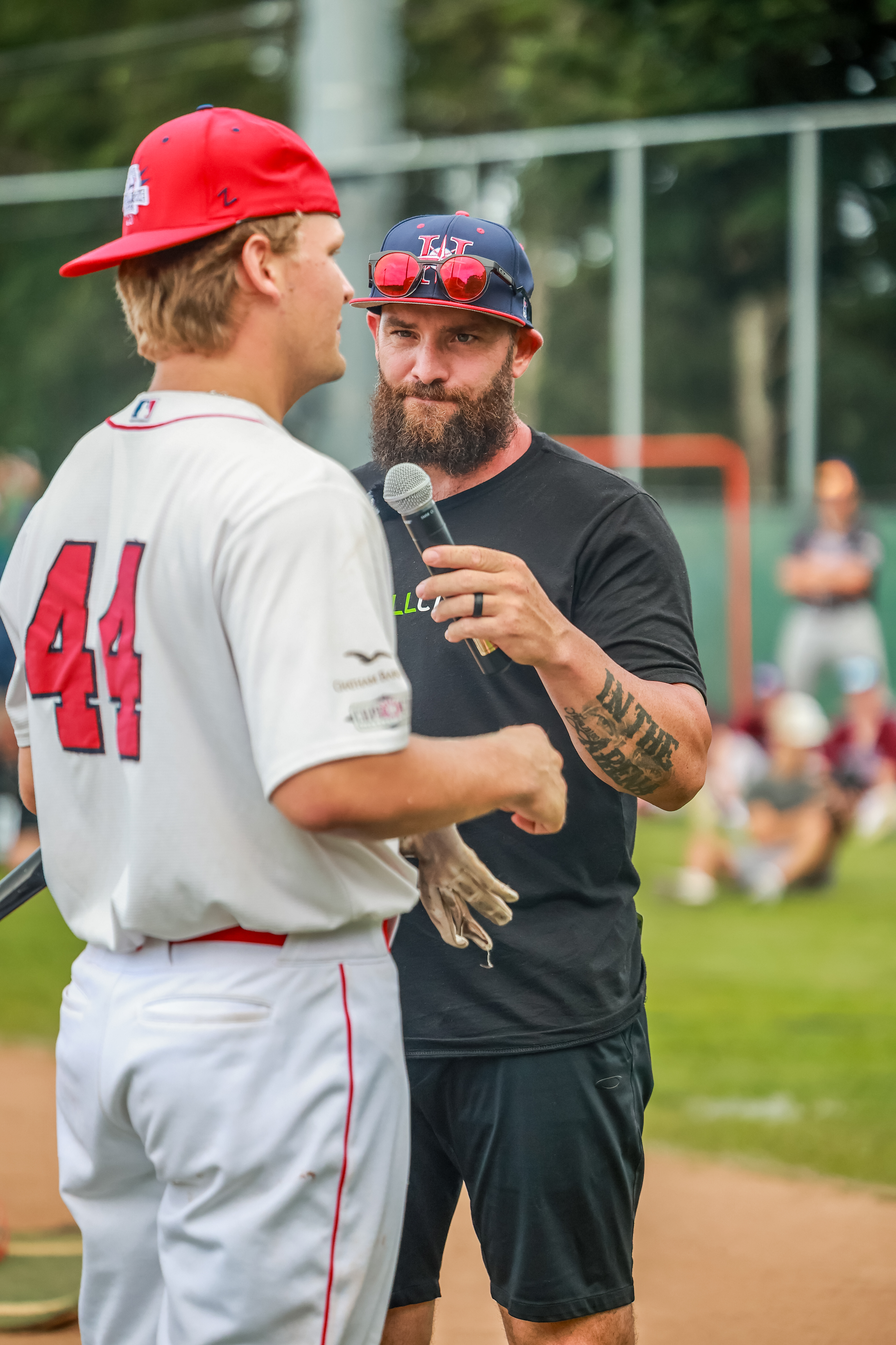 Jonny Gomes speaks with Mississippi State and Yarmouth-Dennis Red Sox slugger Hunter Hines. (Photo courtesy the Cape Cod Baseball League)