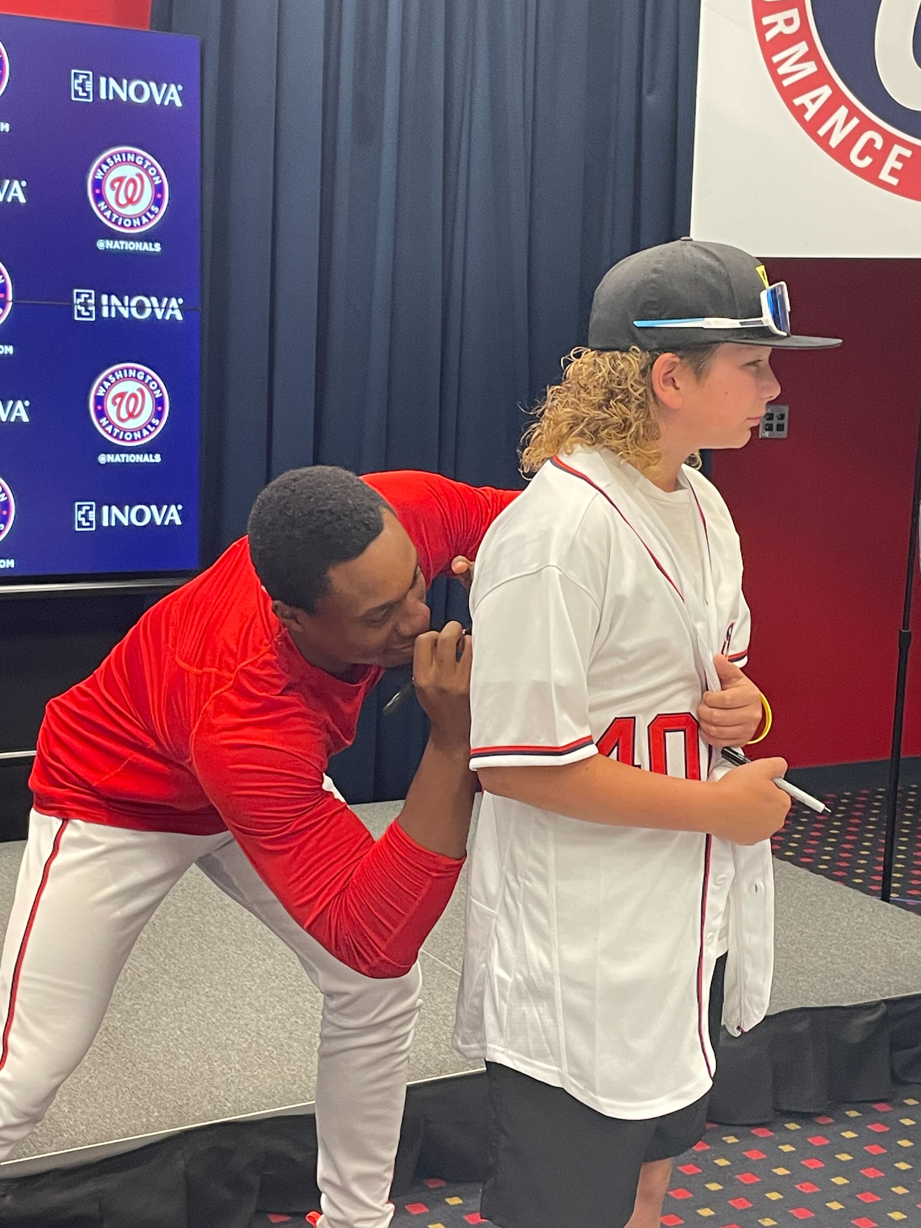 Gray autographs Maxx Pusey's jersey