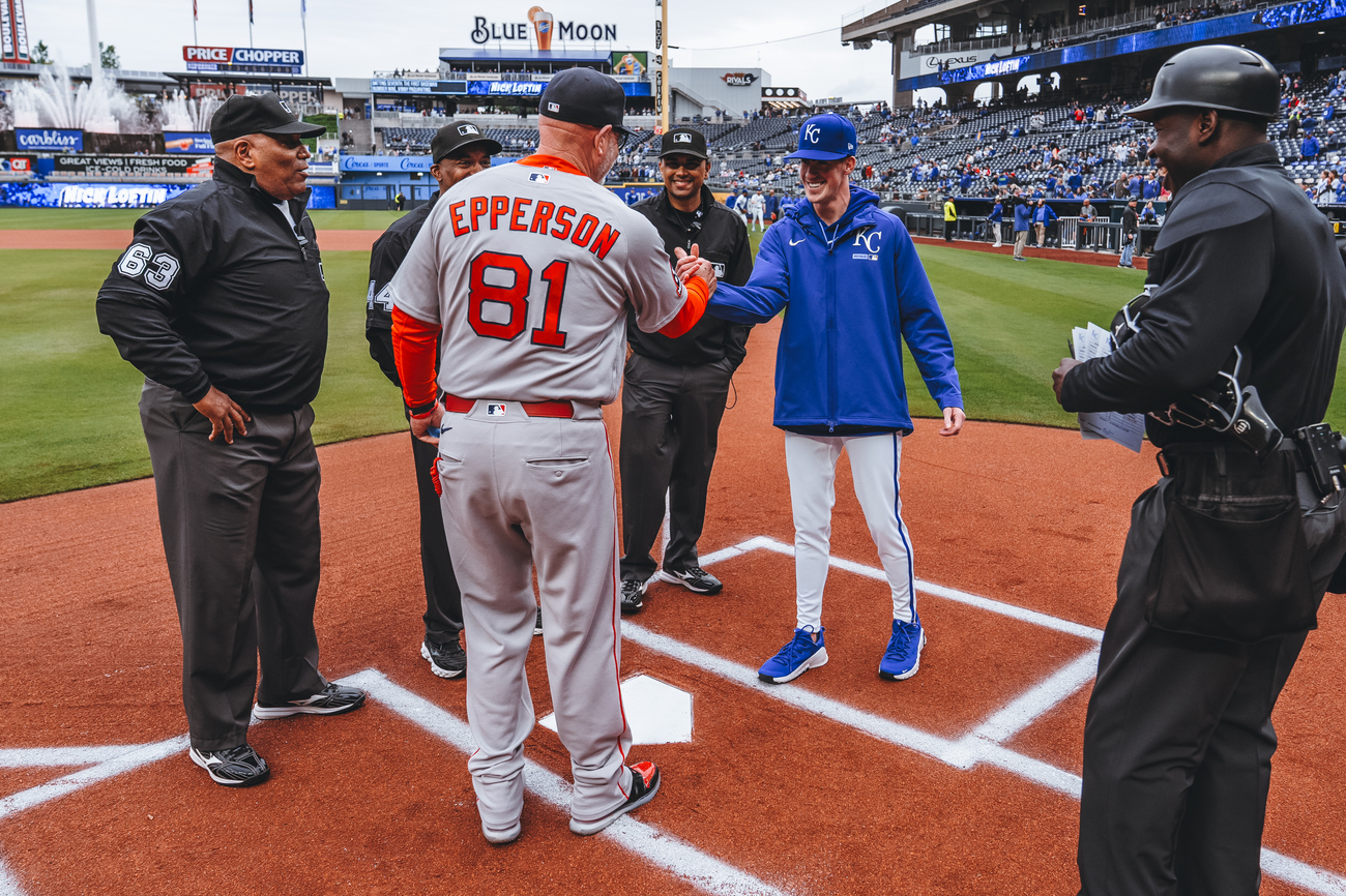 Chad and Drew Epperson meeting at home plate (Courtesy of Drew Epperson)