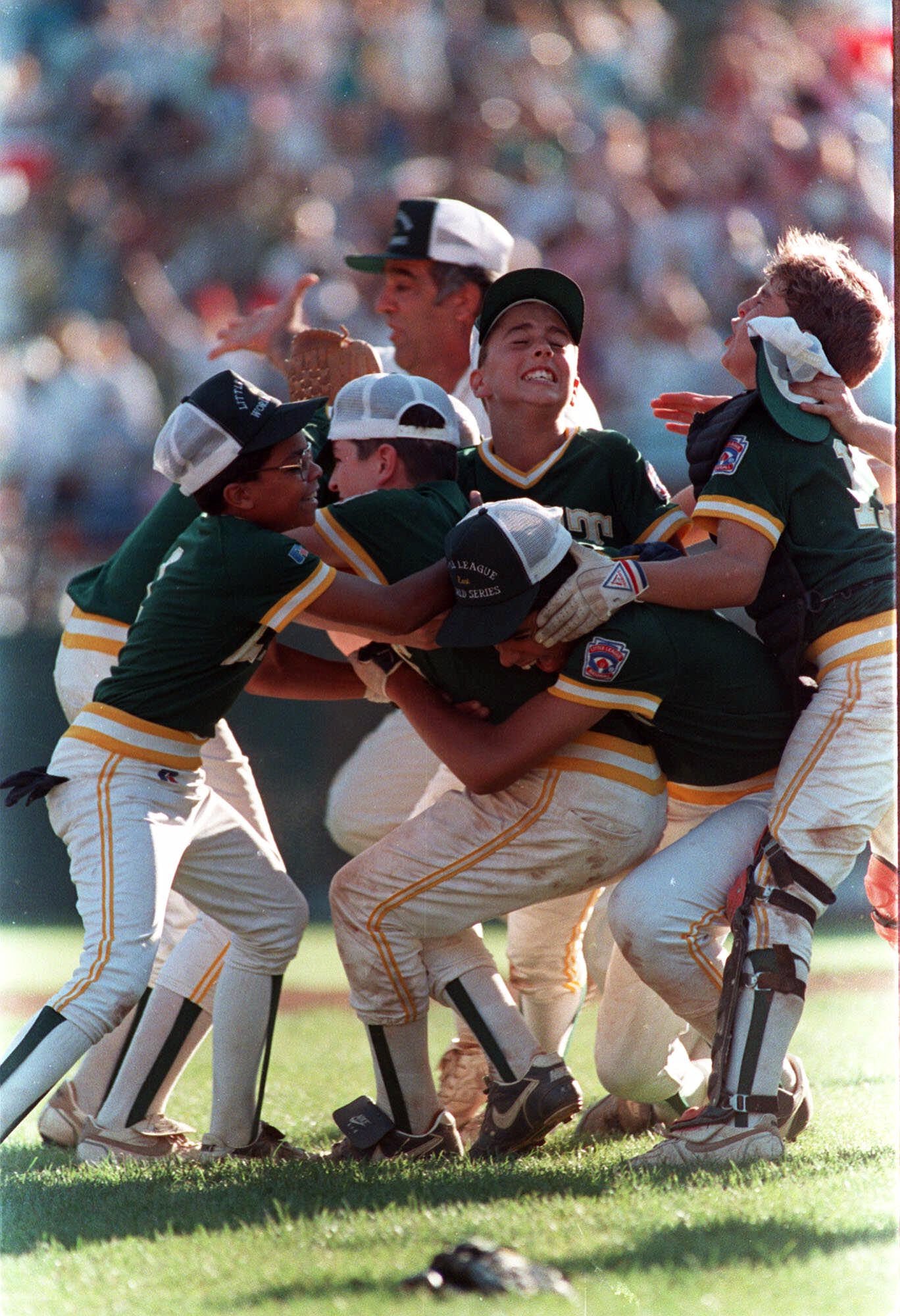 Members of the Trumbull Little League team celebrate their victory (AP Images)
