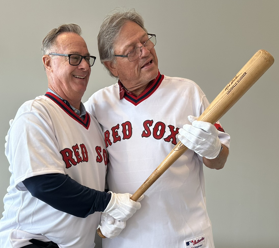 Carlton Fisk, who used the bat of teammate Rick Burleson (left) to hit one of the most memorable postseason home runs, was reunited with the historical piece of lumber at Fenway Park earlier this year. (National Baseball Hall of Fame and Museum)
