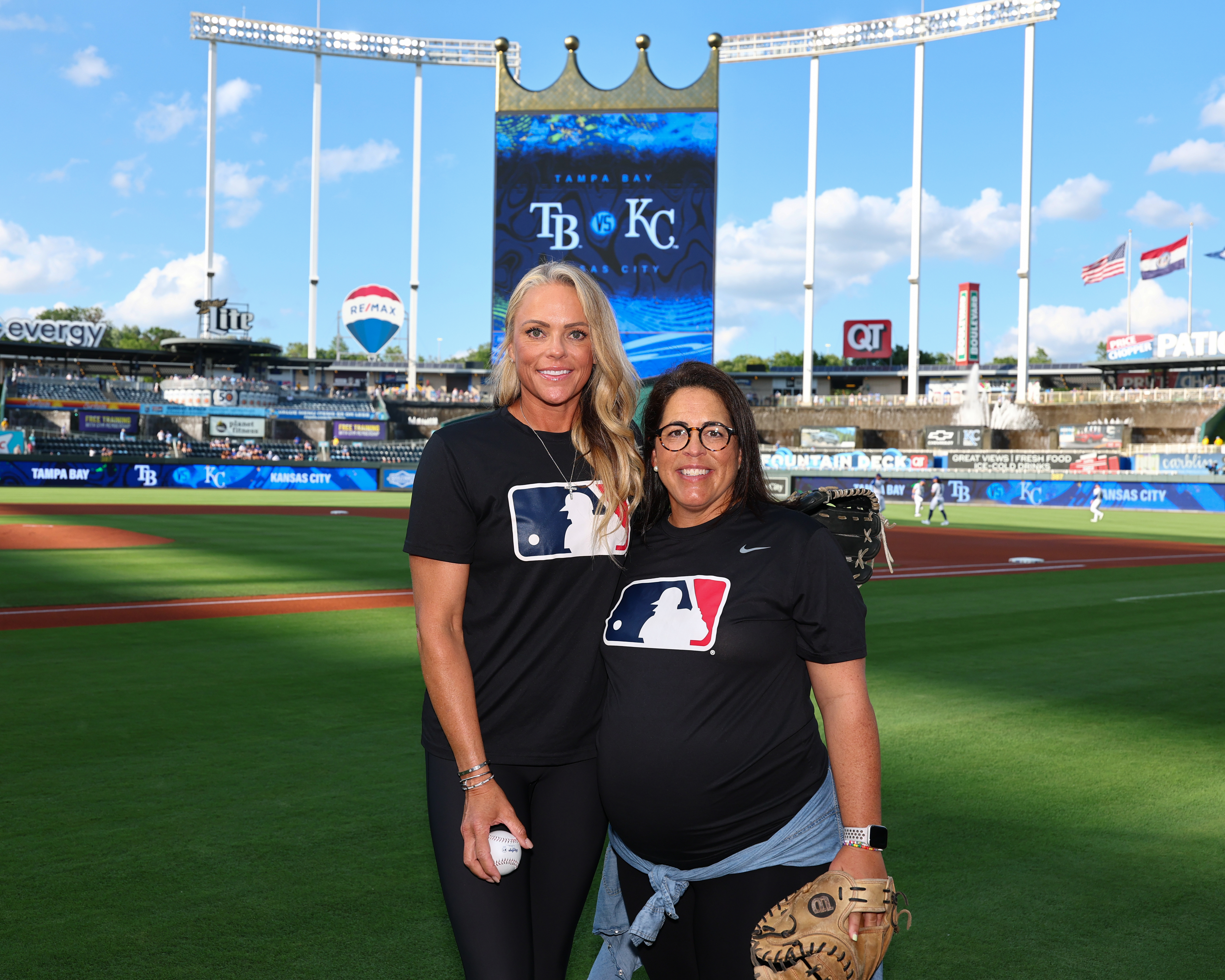 Jennie Finch (left) after throwing out the first pitch to Veronica Alvarez (right) ahead of the Rays-Royals game Wednesday.