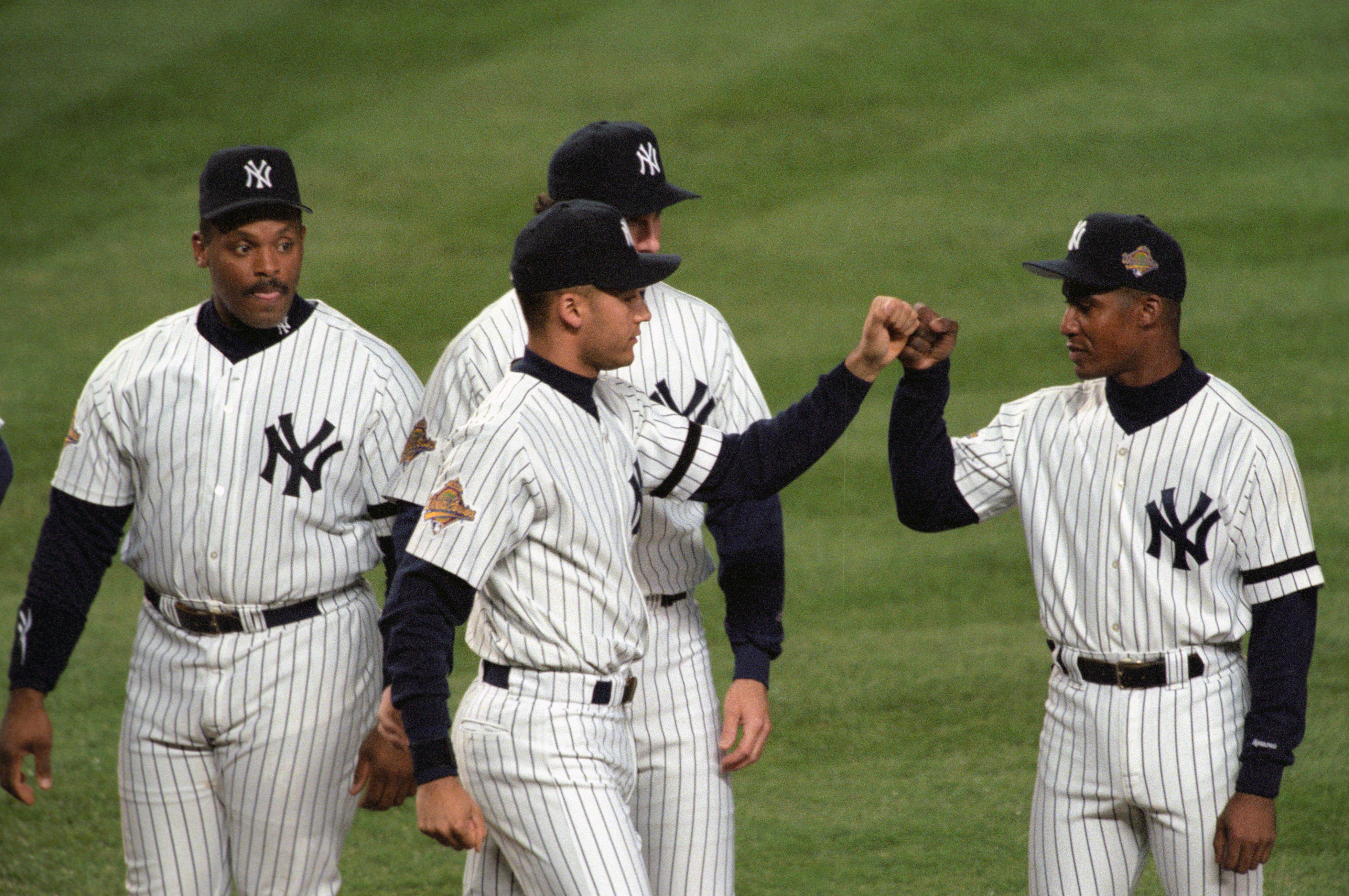 Duncan (right) offered crucial mentorship to Jeter (center) during the shortstop’s rookie season, a bond that began in Spring Training and continued through the World Series. Helping develop the young Yankees stars meant everything to the Dominican Republic native, and he delivered in spades. “The biggest contributions I made were the experience and leadership that I brought to the ballclub, more so than what I did on the field,” Duncan said. (Photo Credit: Getty Images)