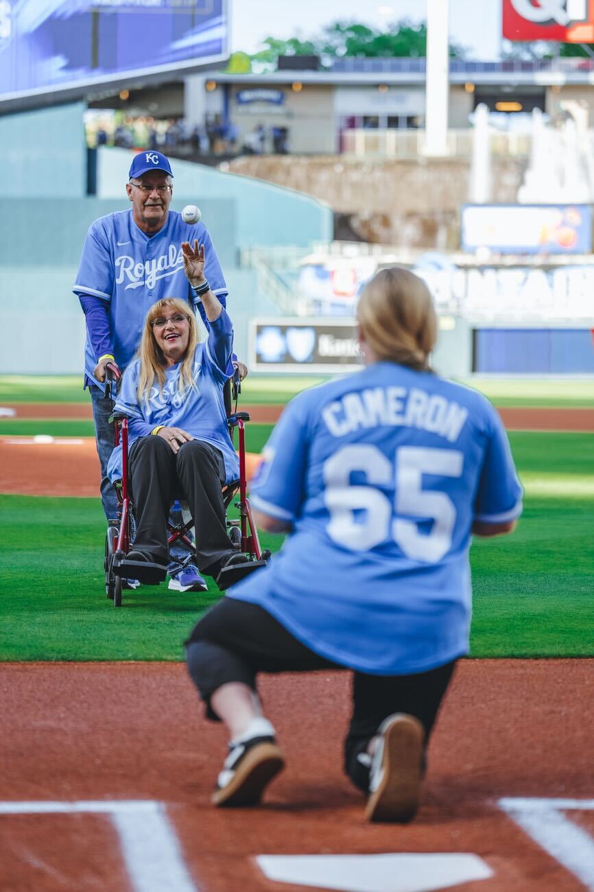 Noah Cameron's mother, Diane, throws out the first pitch on Mother's Day. (Courtesy Kansas City Royals)
