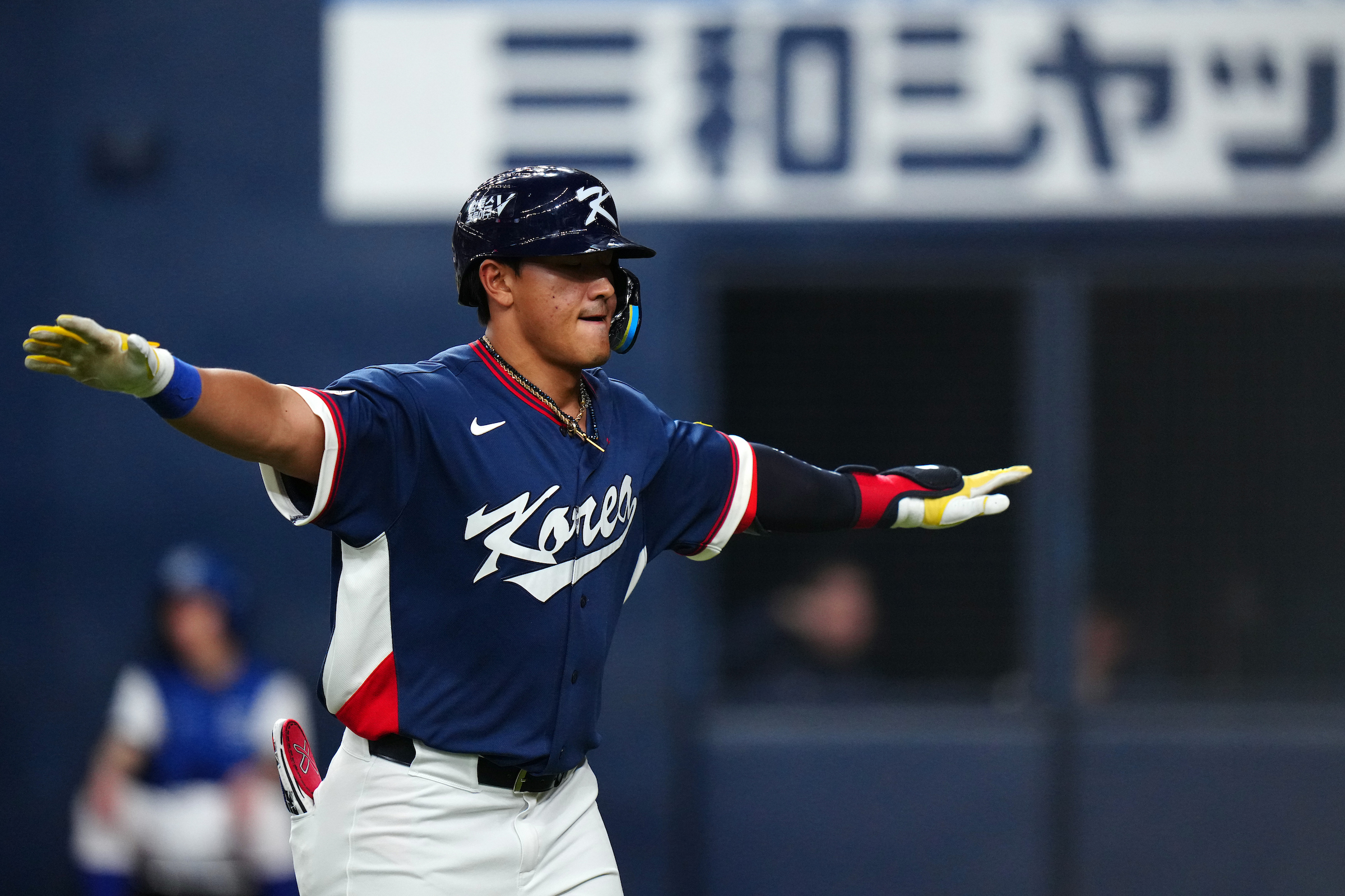 Hyun-min Ahn celebrates after crossing home plate. Photo by Daniel Shirey.