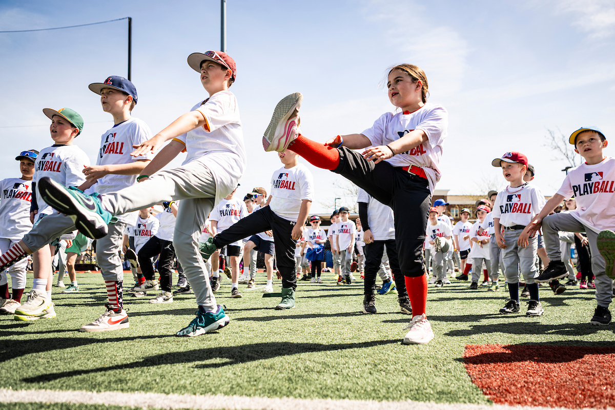 Attendees participate in activity during Play Ball event in Plymouth, Massachusetts.