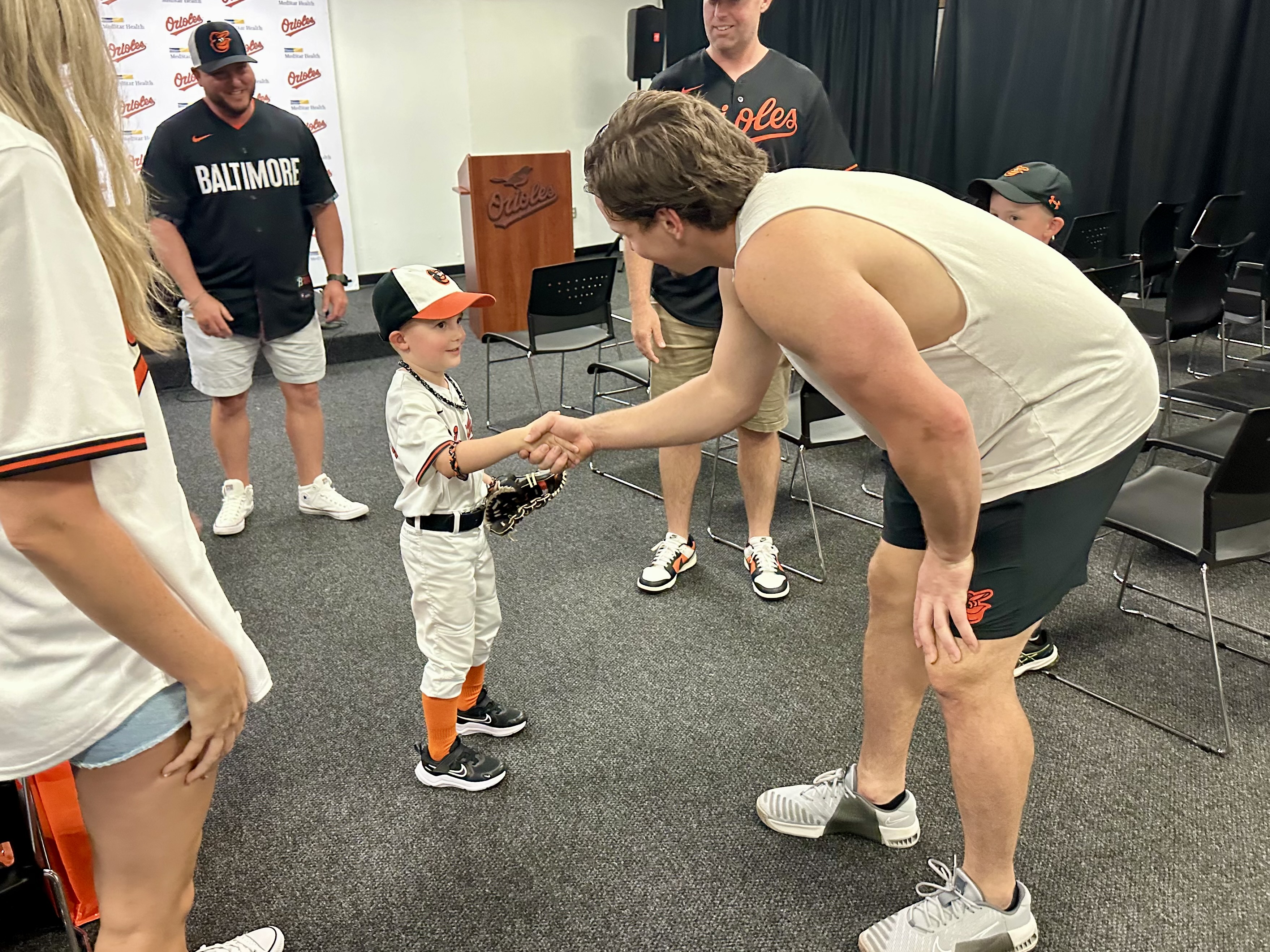Henry (left) shakes hands with Adley Rutschman.