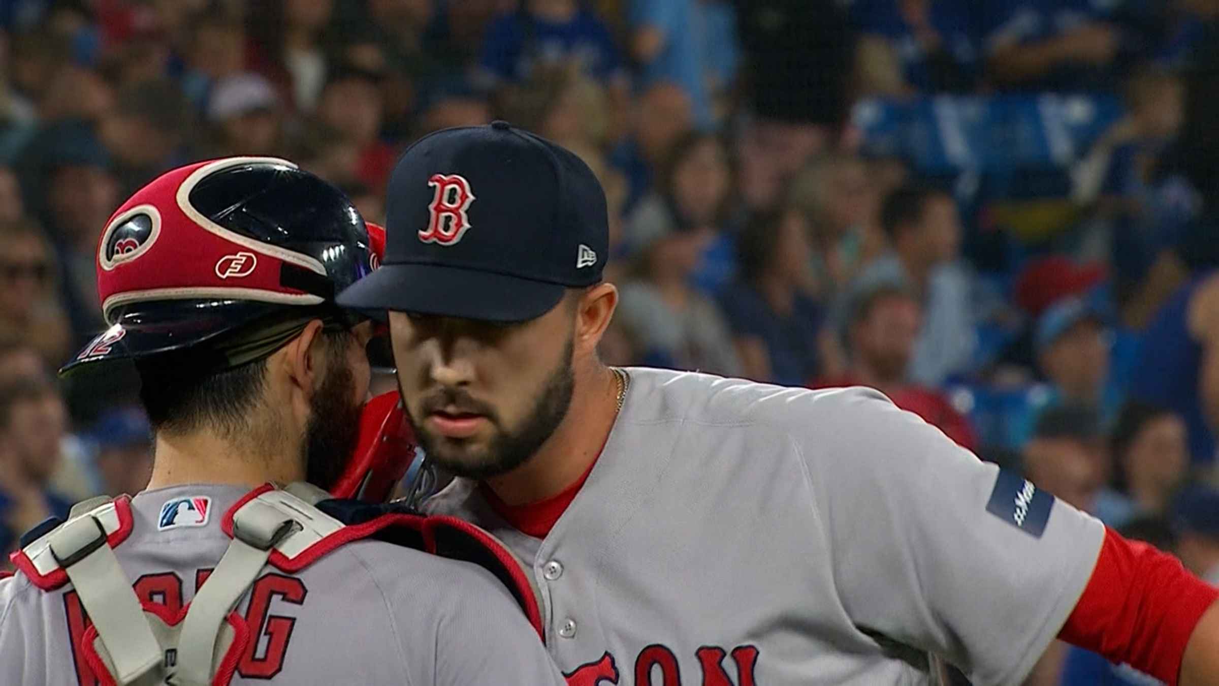 Boston Red Sox pitcher Matt Clement sits on the mound after being