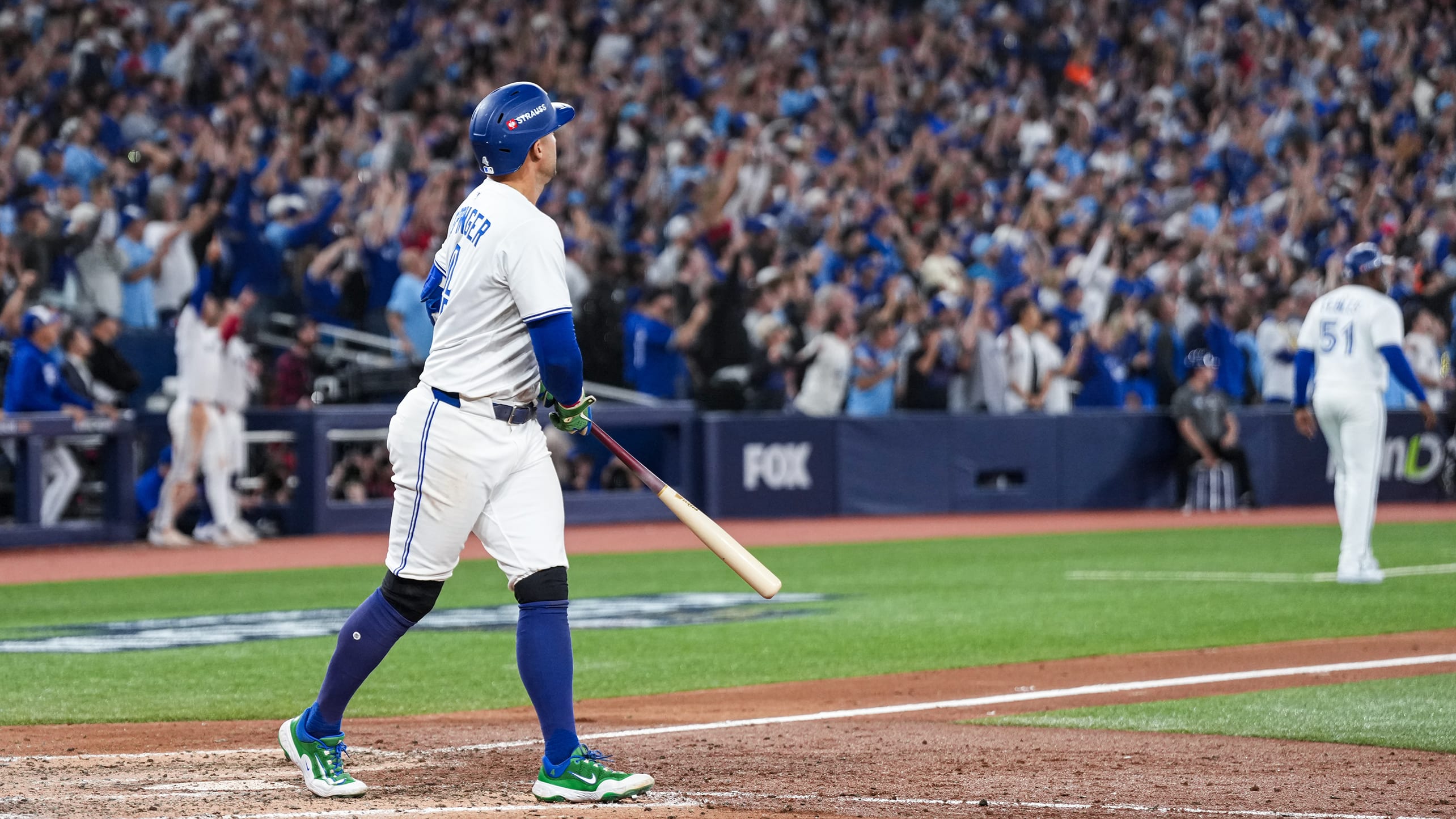 George Springer watches the flight of his home run as the fans cheer