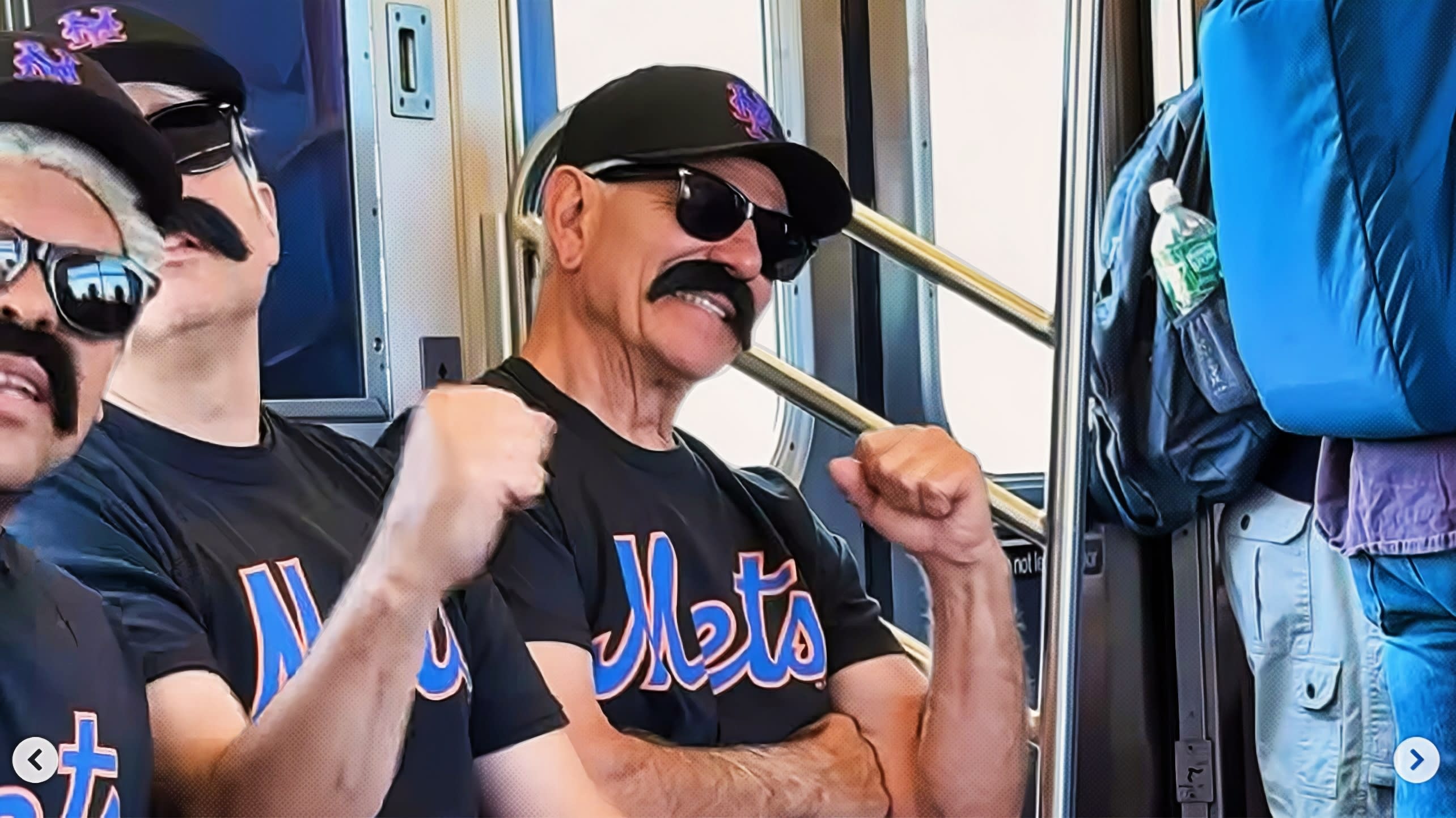 Bobby Valentine wearing a disguise on a subway train