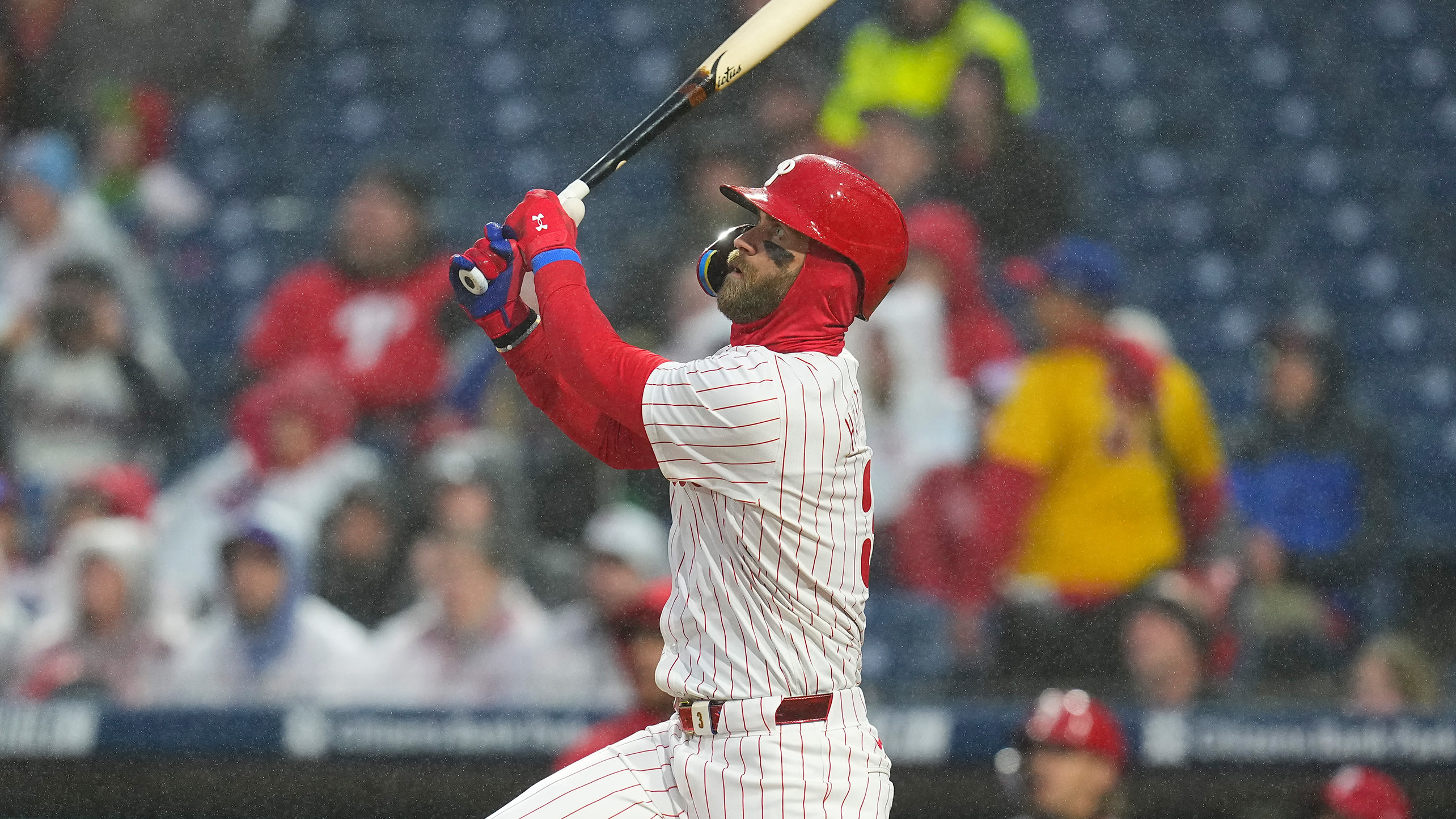 Bryce Harper slugged three homers in the rain