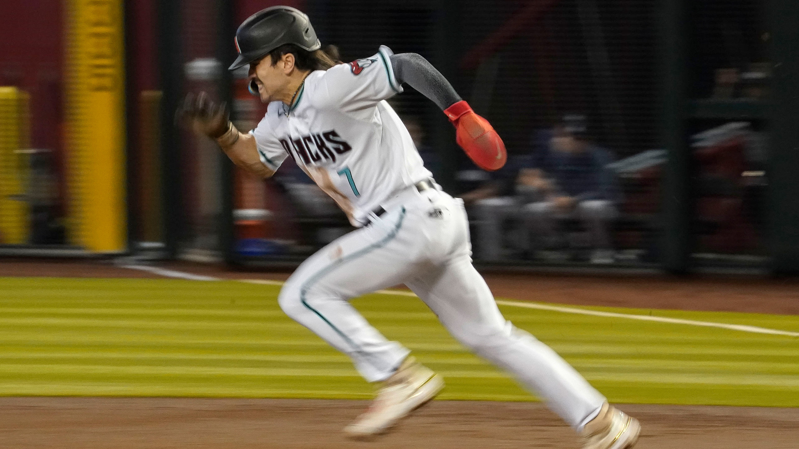 Corbin Carroll runs toward second base