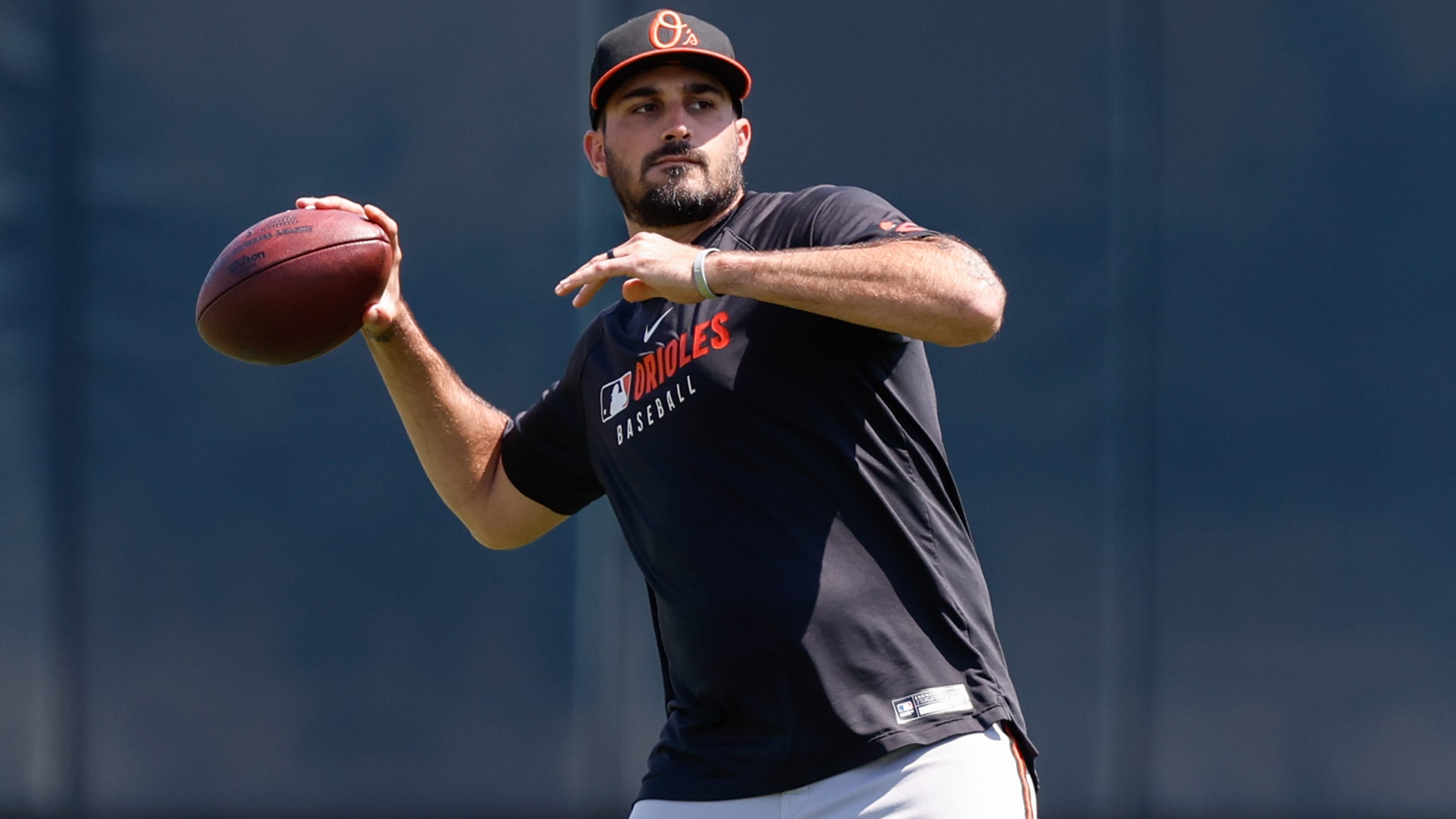Zach Eflin throws a football