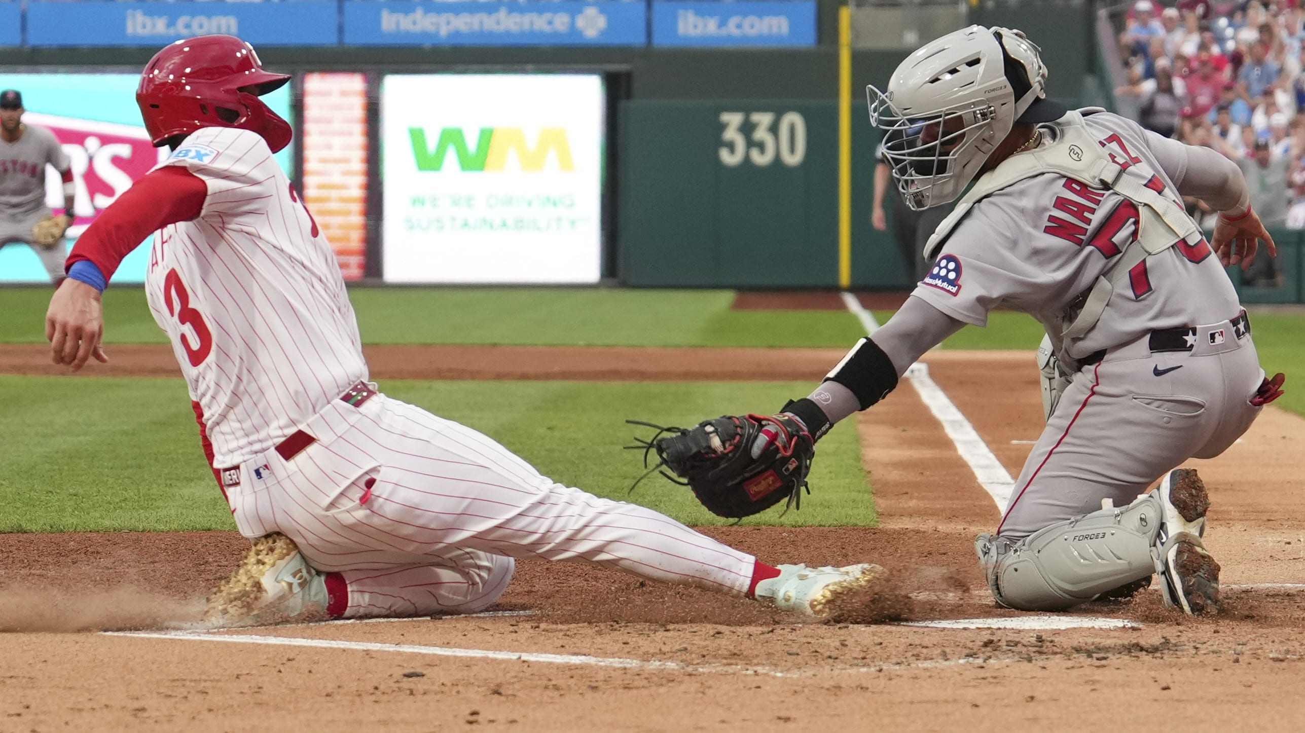 Bryce Harper slides into home
