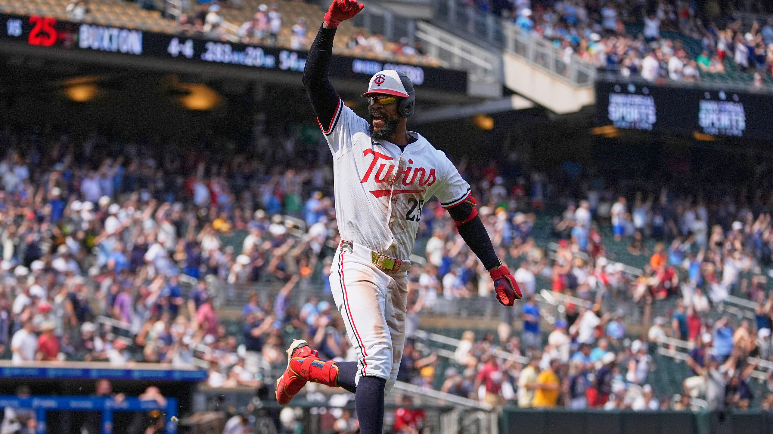 Byron Buxton celebrates after homering to complete a cycle