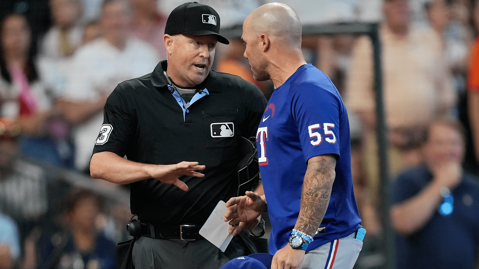 Umpire Todd Tichenor and Rangers manager Skip Schumaker argue