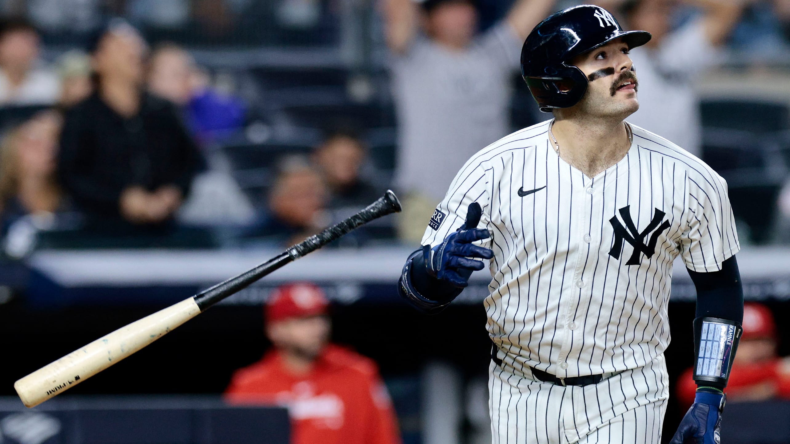 The Yankees' Austin Wells flips his bat away after hitting a home run