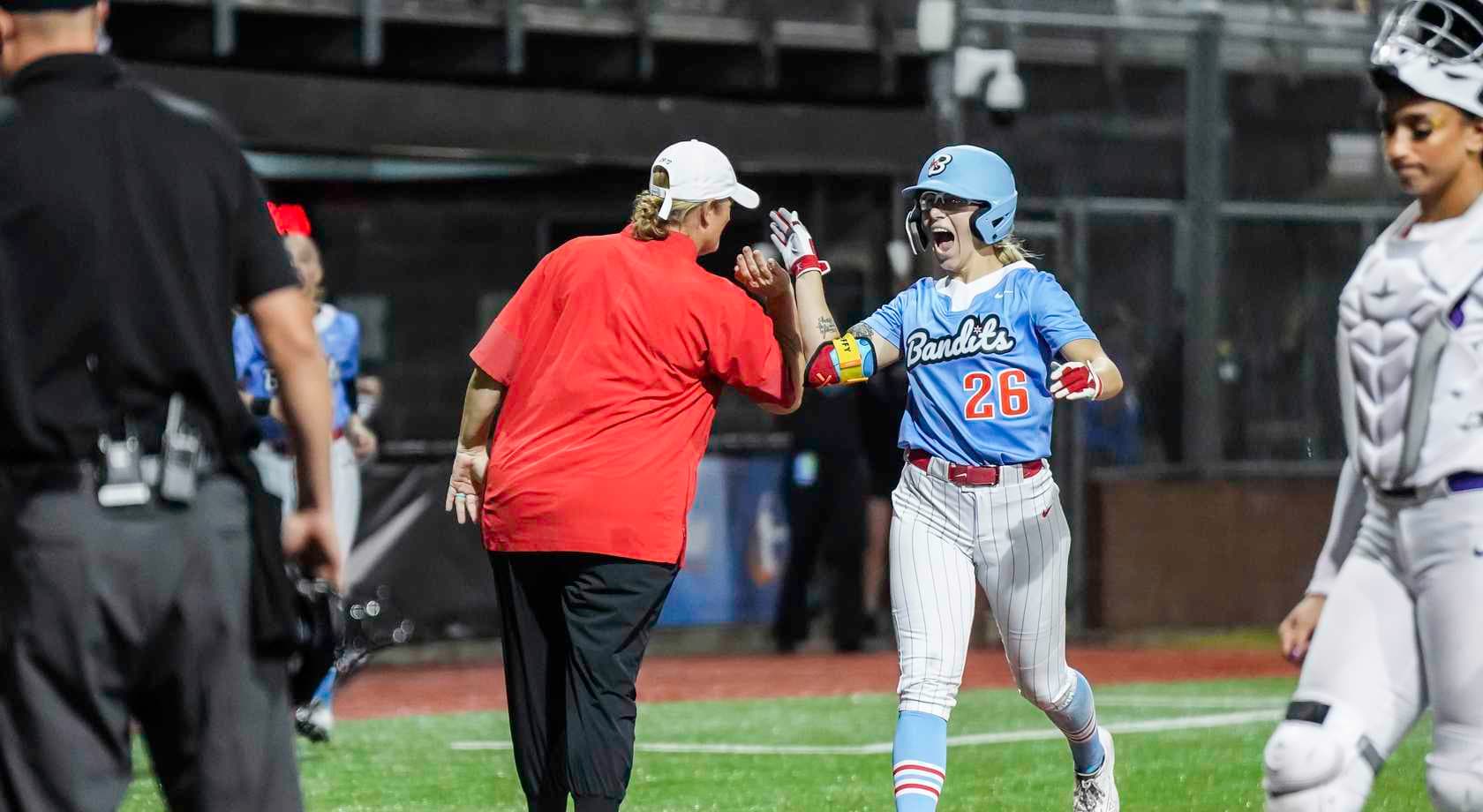Sydney McKinney is congratulated after a home run