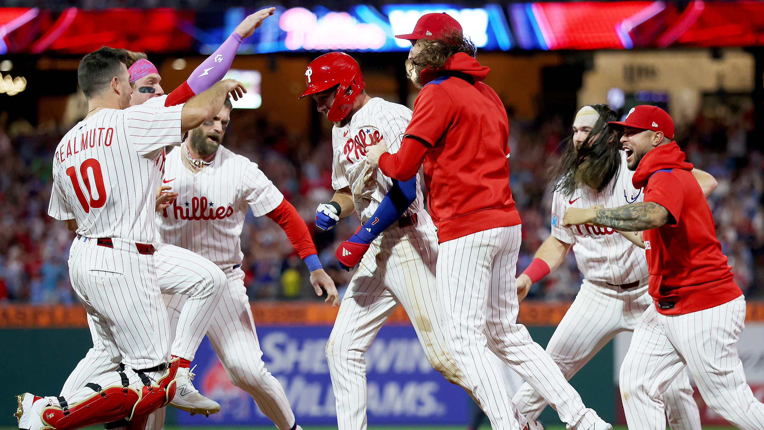 Trea Turner is mobbed by teammates after his walk-off hit