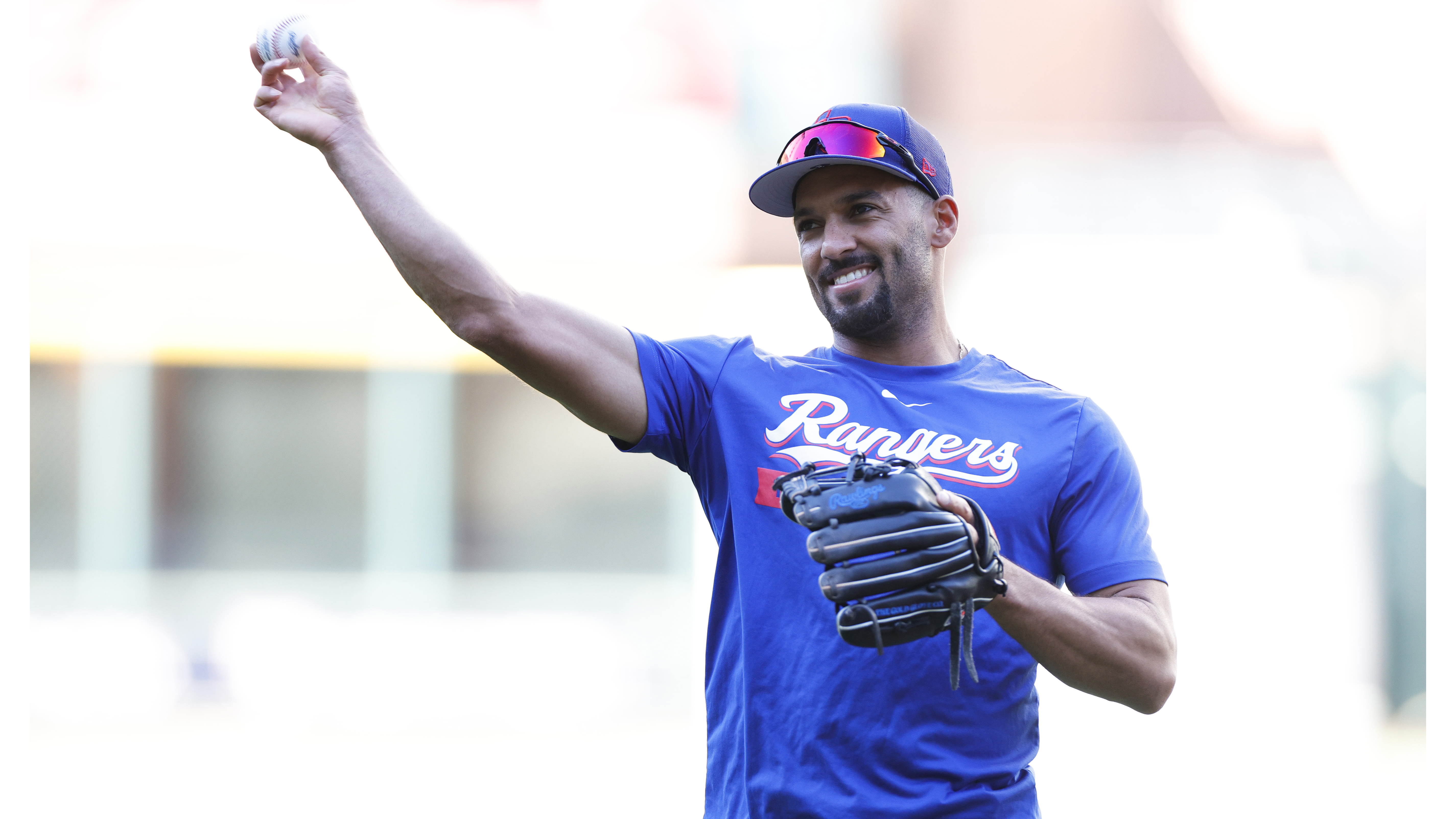 Marcus Semien throws a baseball