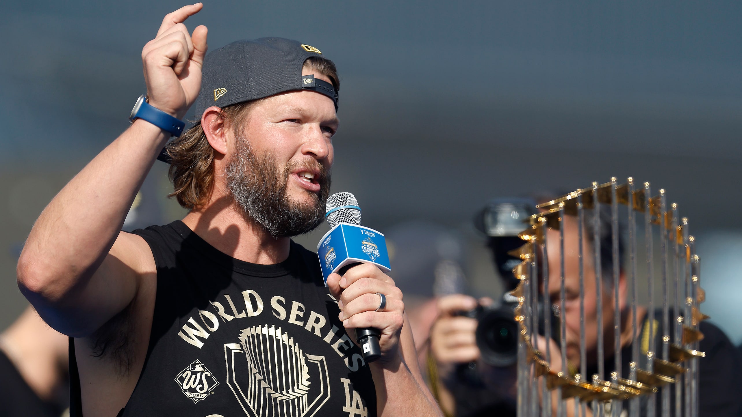 Clayton Kershaw speaks next to the 2025 World Series trophy