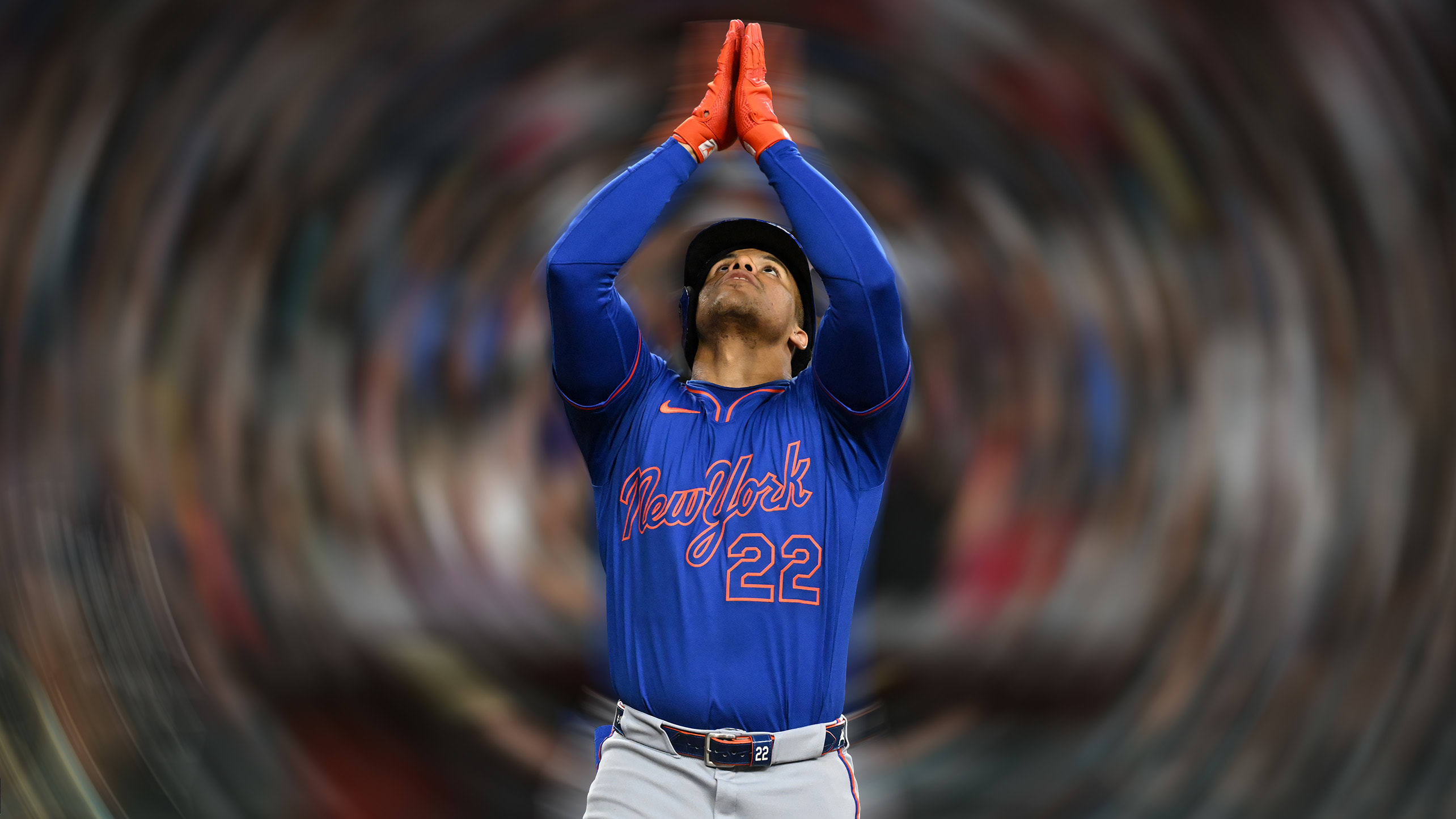 Juan Soto raises his hands in a prayer motion after touching home plate