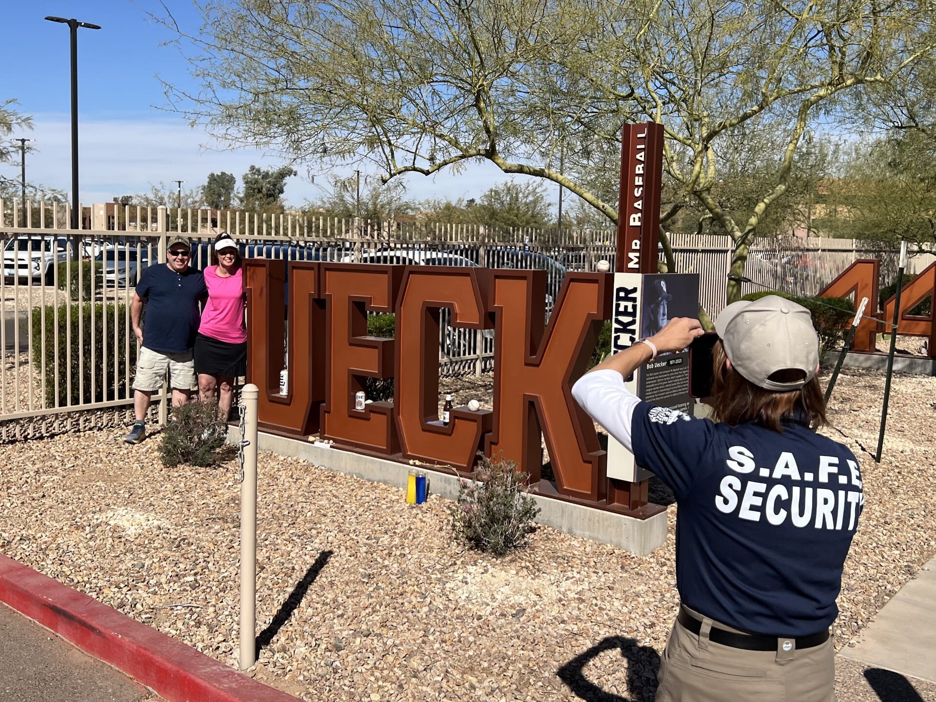 Fans pose with a ''UECK'' sign