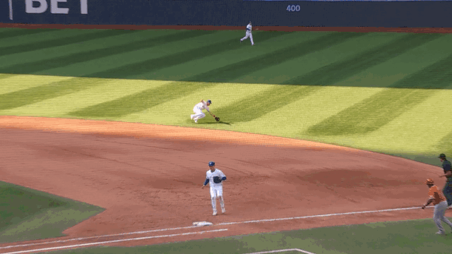 An animated gif of Ernie Clement making a diving play